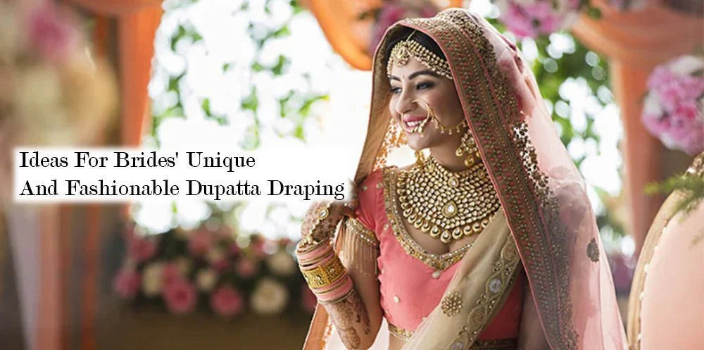 Indian bride in pink and gold lehenga with ornate dupatta draping, wearing bridal jewelry.