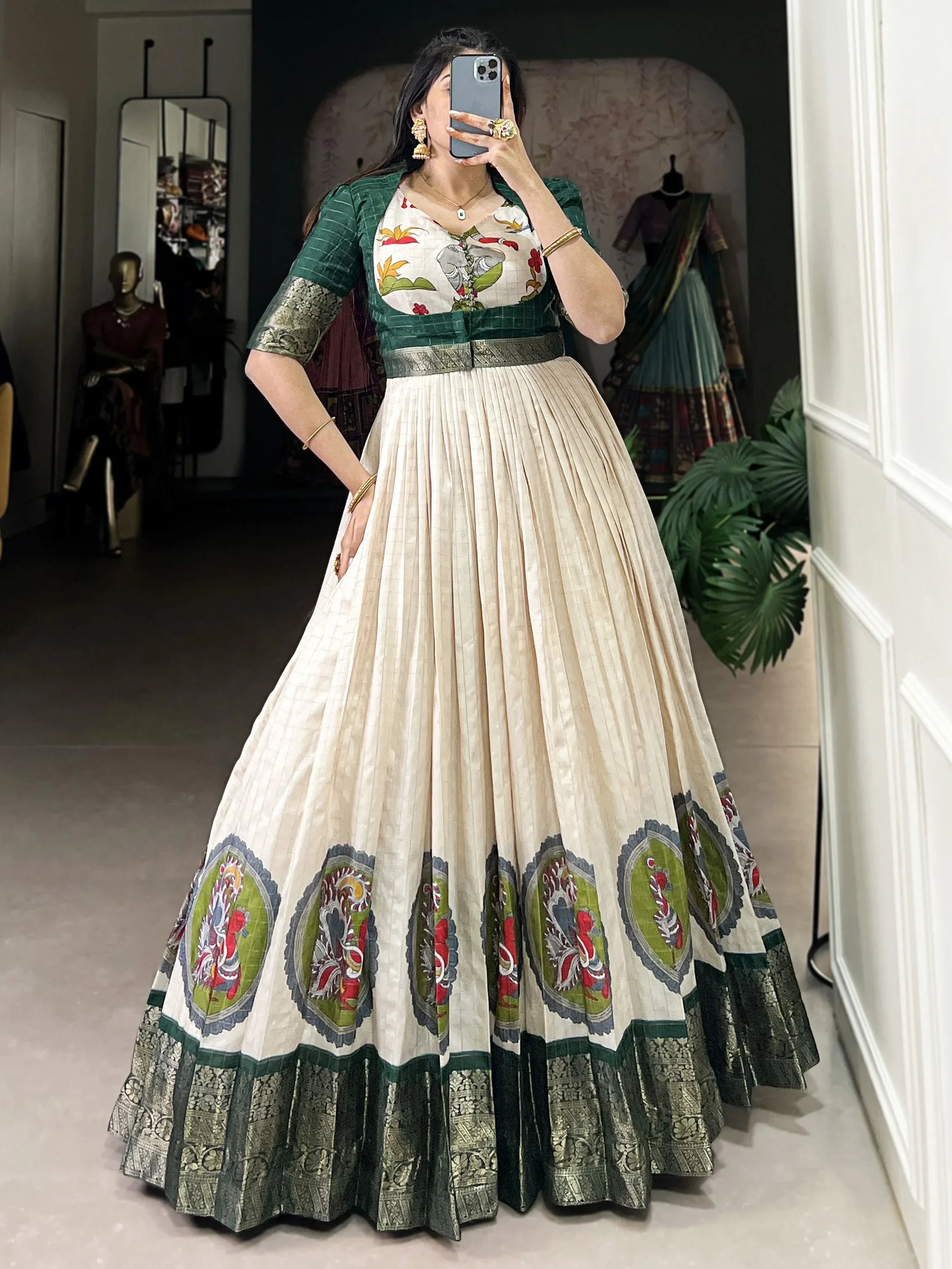 Cream engagement gown with green embroidered bodice and printed ethnic border design