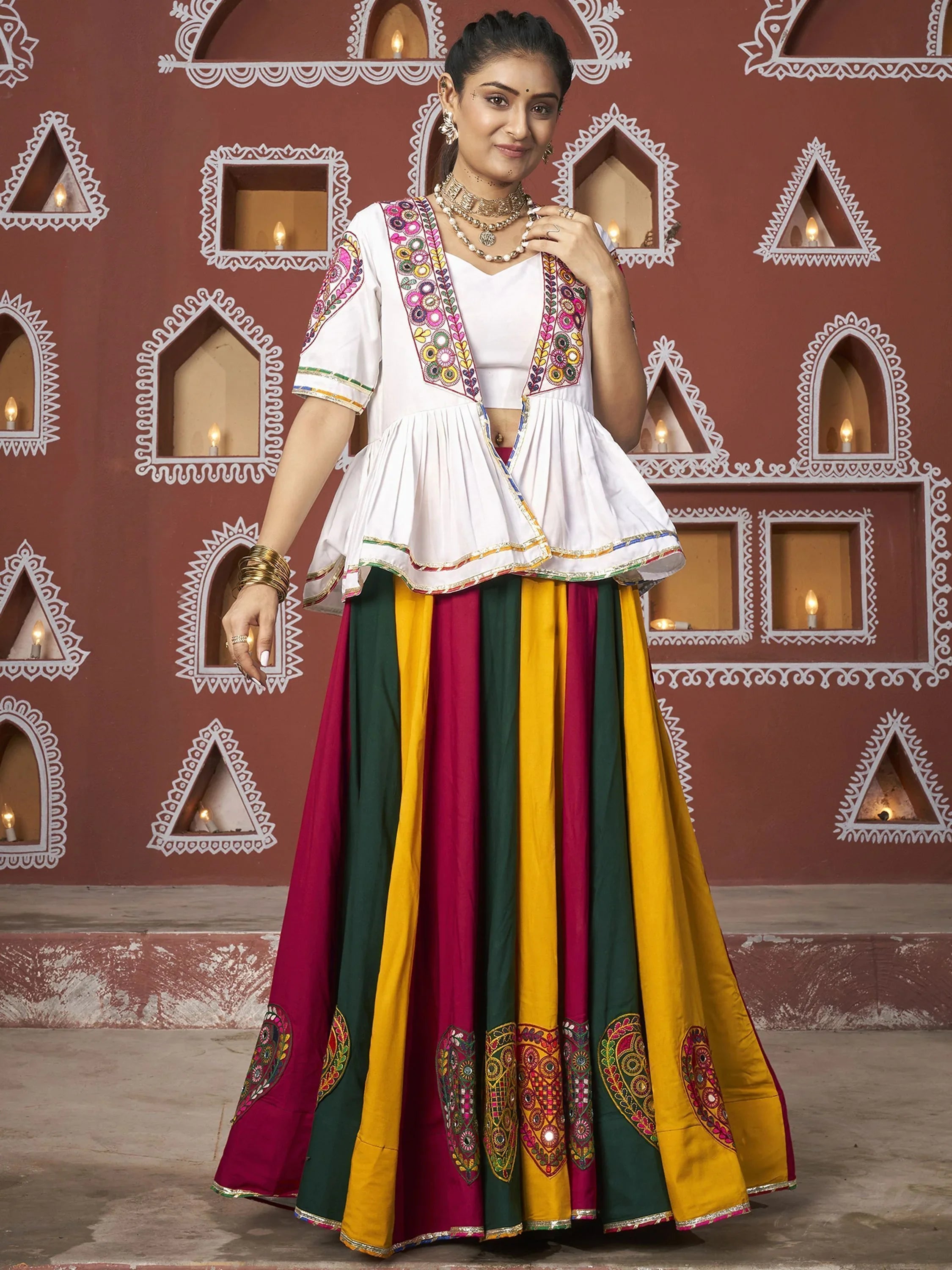Woman wearing Lakhnavi work Navratri lehenga choli with multicolor skirt and embroidered dupatta