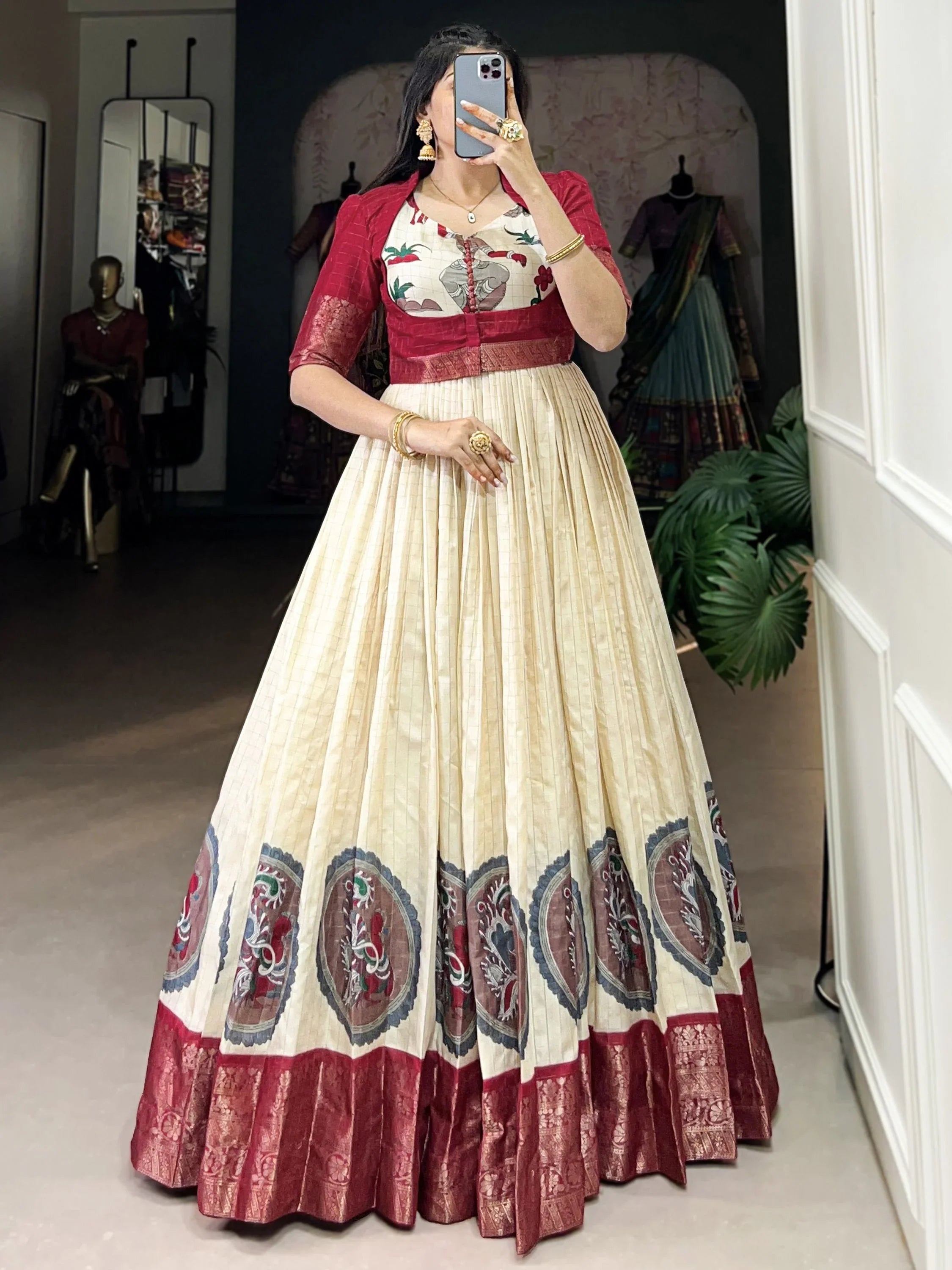 Off-white and maroon engagement gown with floral embroidery and zari border, ethnic wear