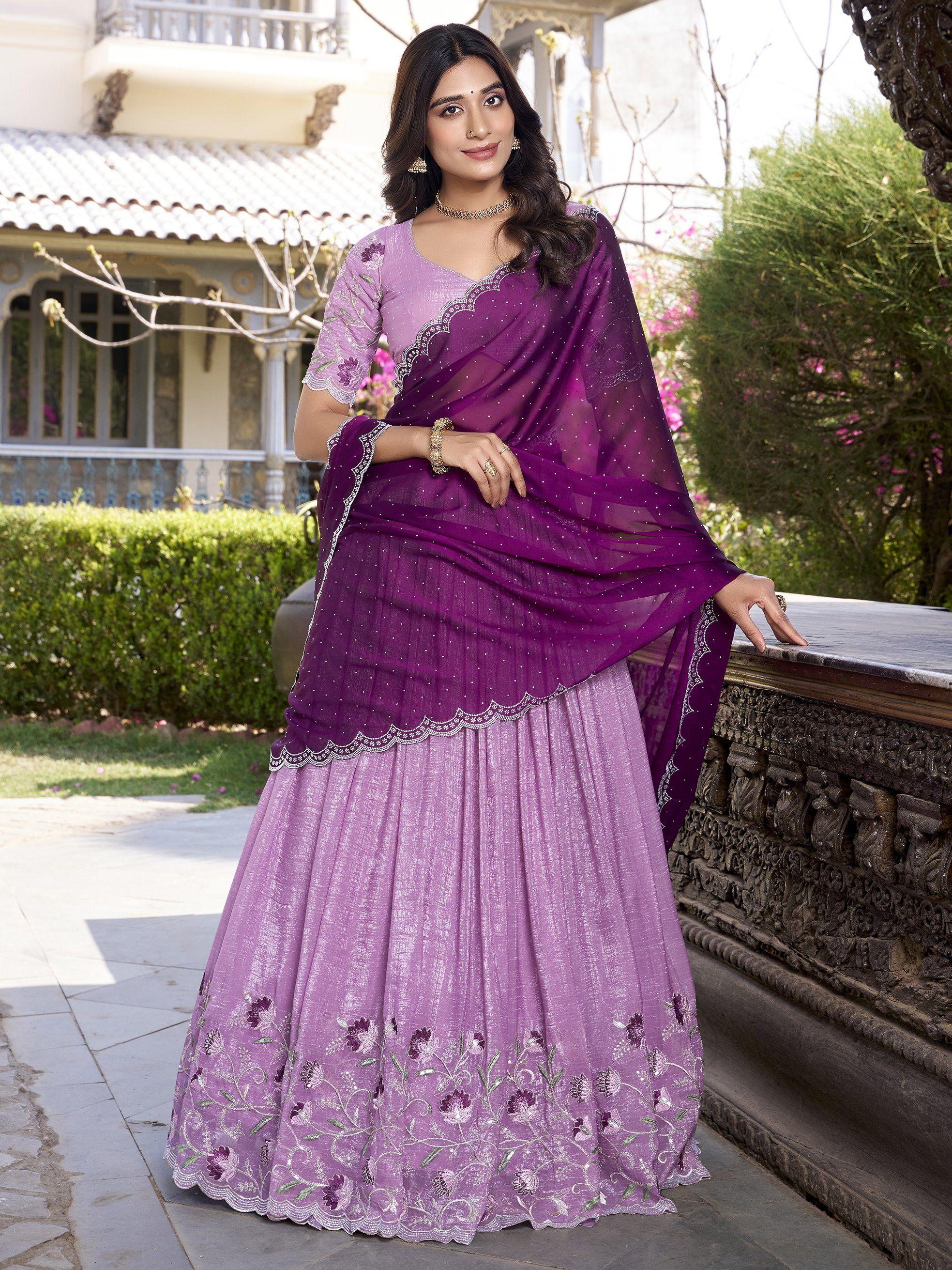 Woman in lavender and purple organza lehenga choli with floral embroidery outdoors