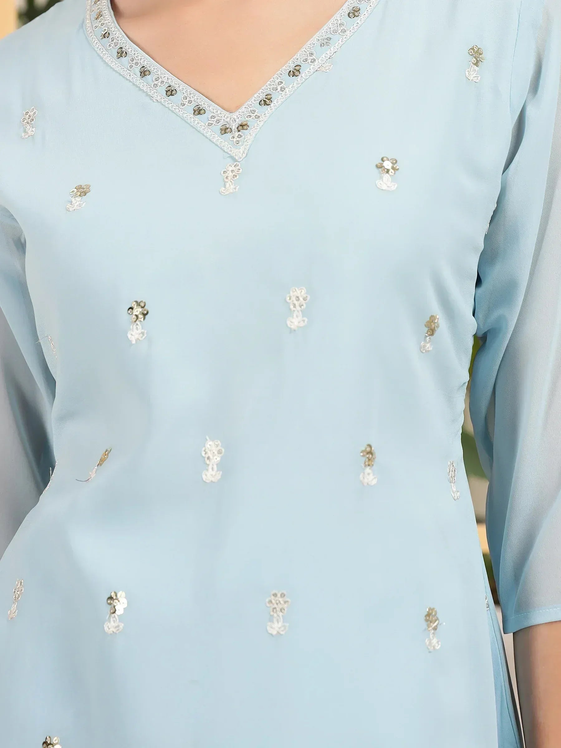 Light blue ethnic kurti with floral embroidery and lace neckline, perfect for Indian wear