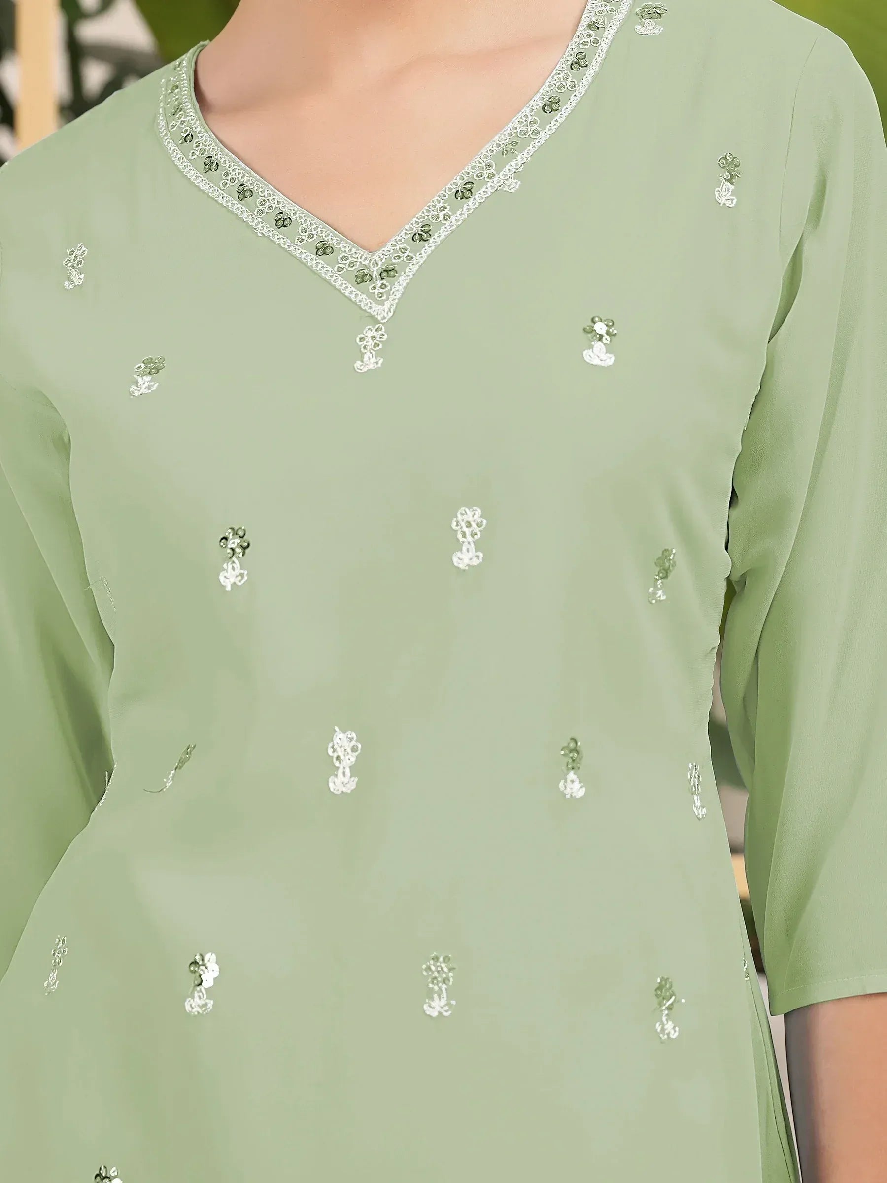 Mint green ethnic kurti with floral sequin embroidery and V-neck lace detailing