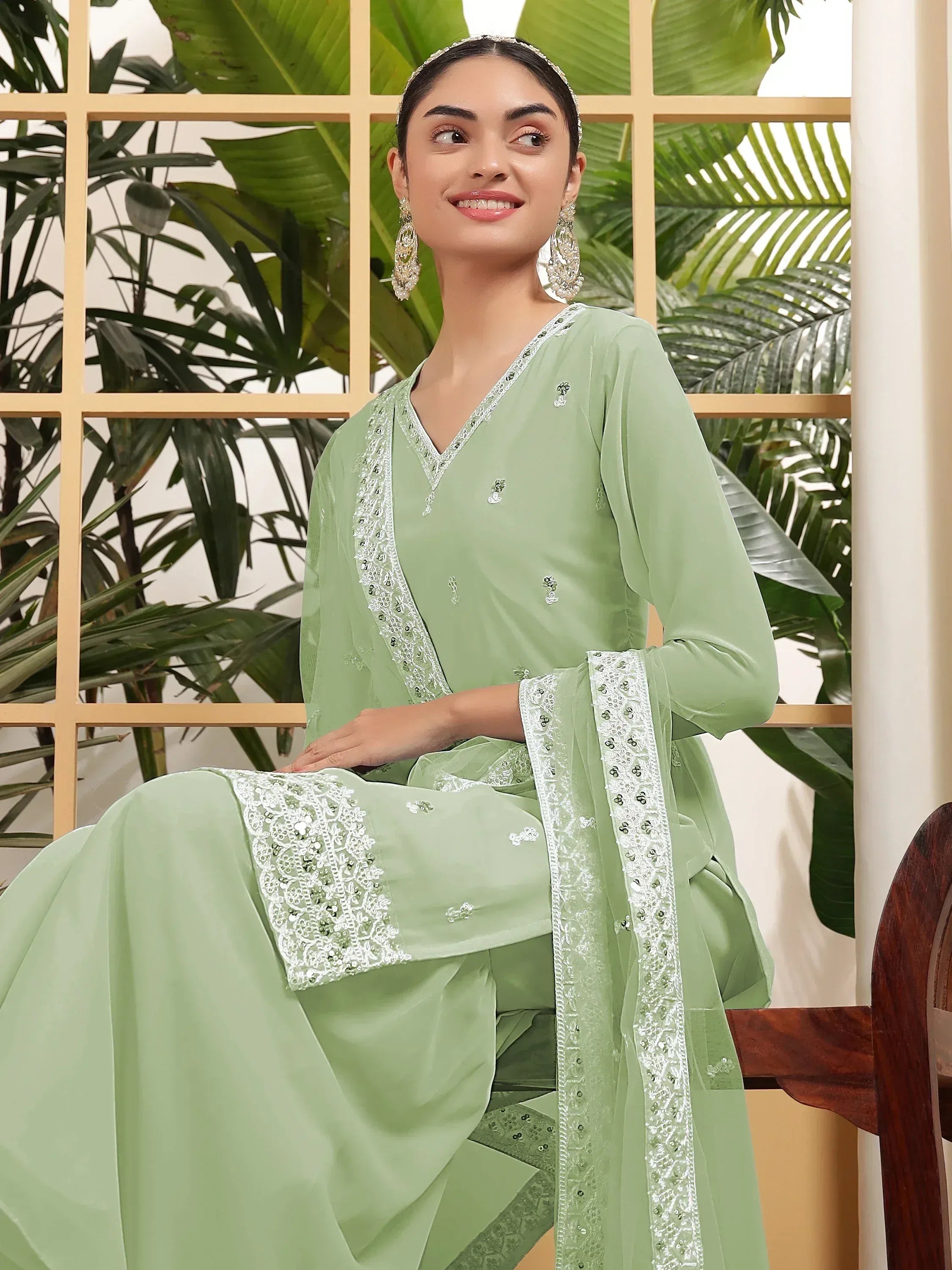 Mint green embroidered salwar kameez with silver detailing, perfect for ethnic wear and festive occasions.
