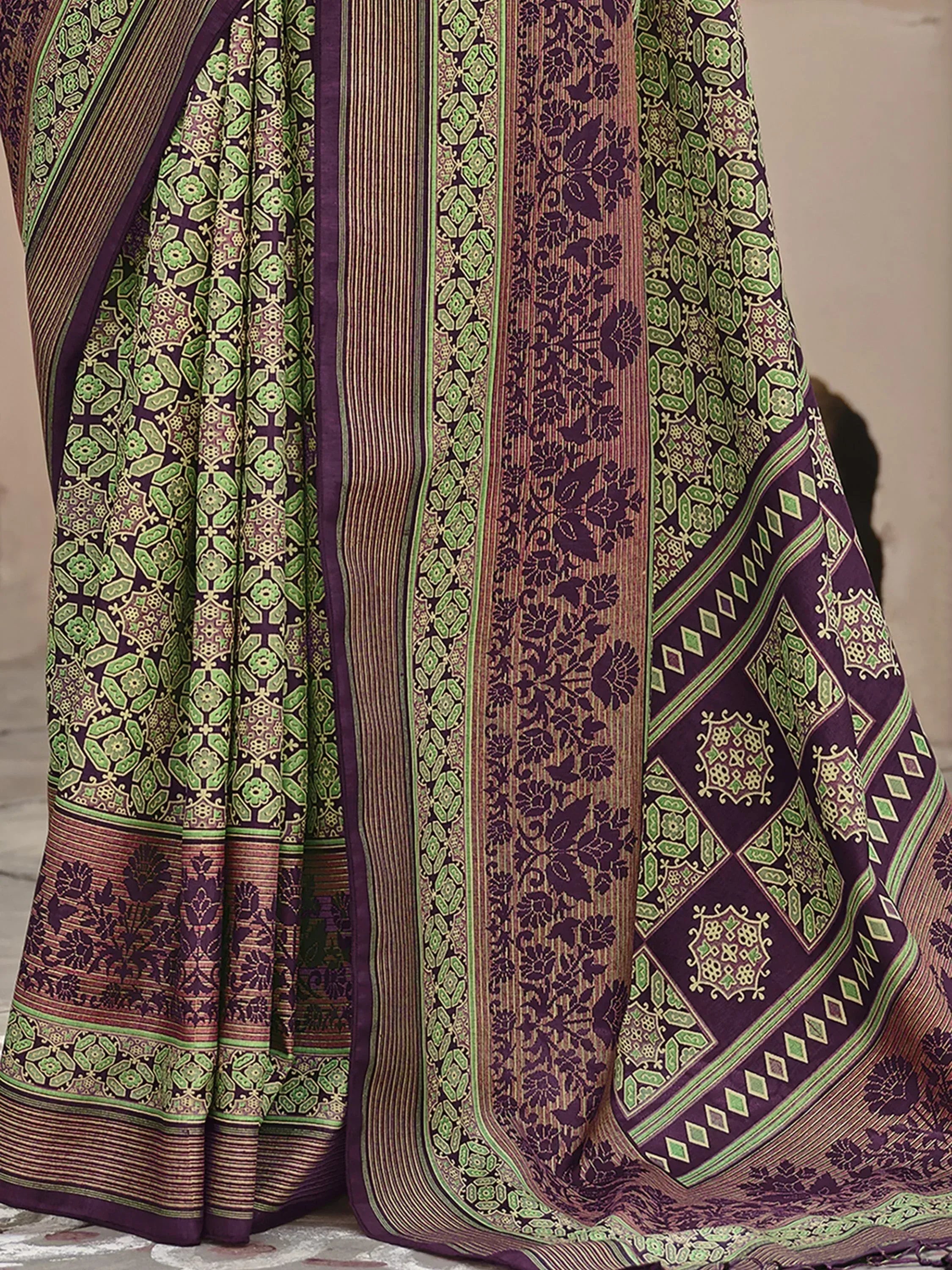Purple and green printed saree with intricate floral and geometric patterns, ideal for ethnic wear