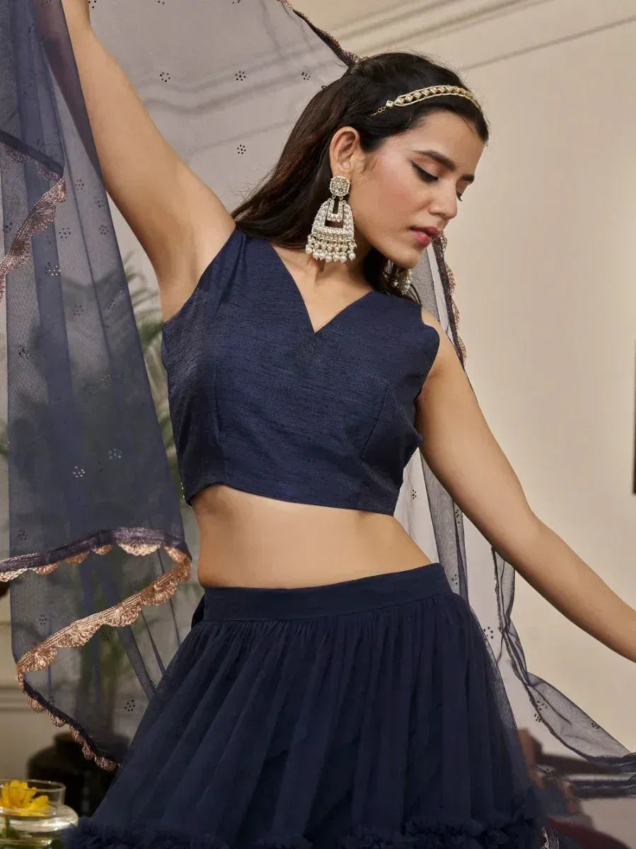Navy blue ethnic lehenga choli with sheer dupatta, perfect for Indian weddings and festive occasions