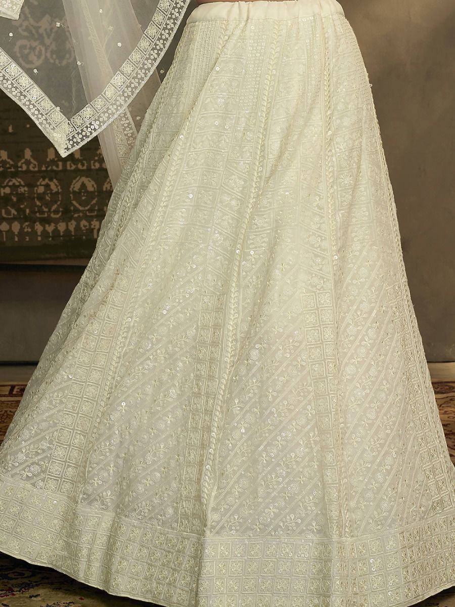 Cream embroidered lehenga with intricate threadwork and sequins, paired with matching dupatta