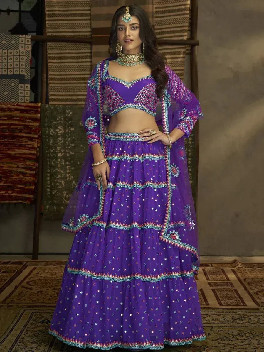 Purple embroidered lehenga choli with mirror work, perfect for Indian ethnic wear and festive occasions.