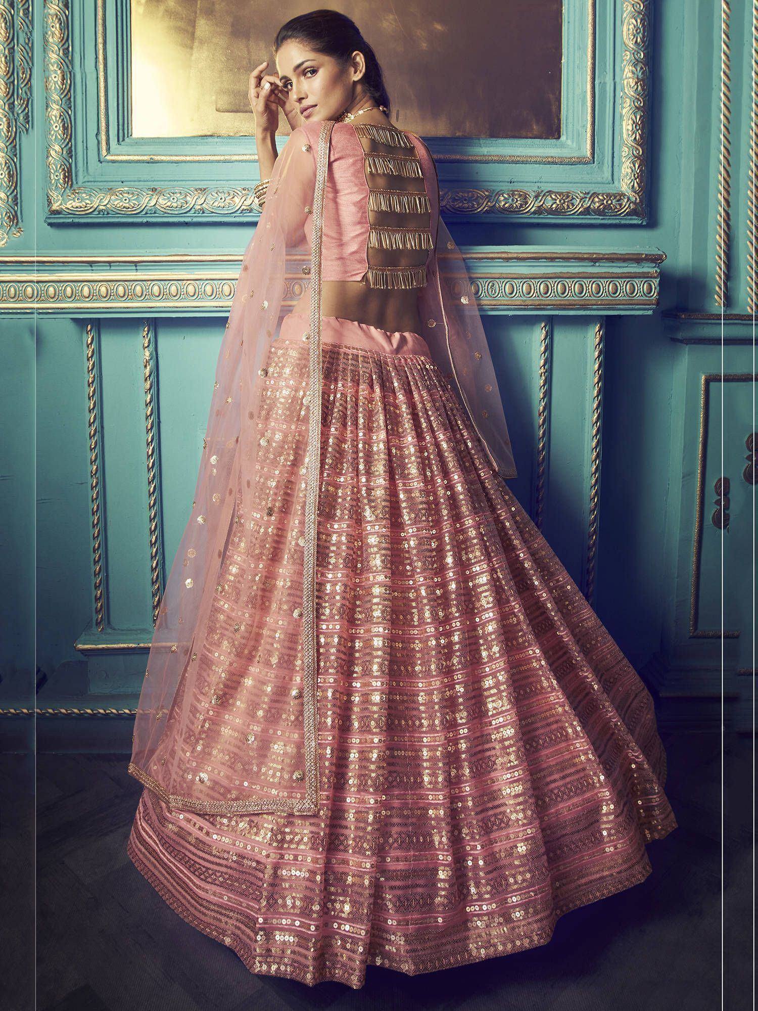 Pink sequin lehenga choli with gold fringe back design, perfect for Indian ethnic wear events