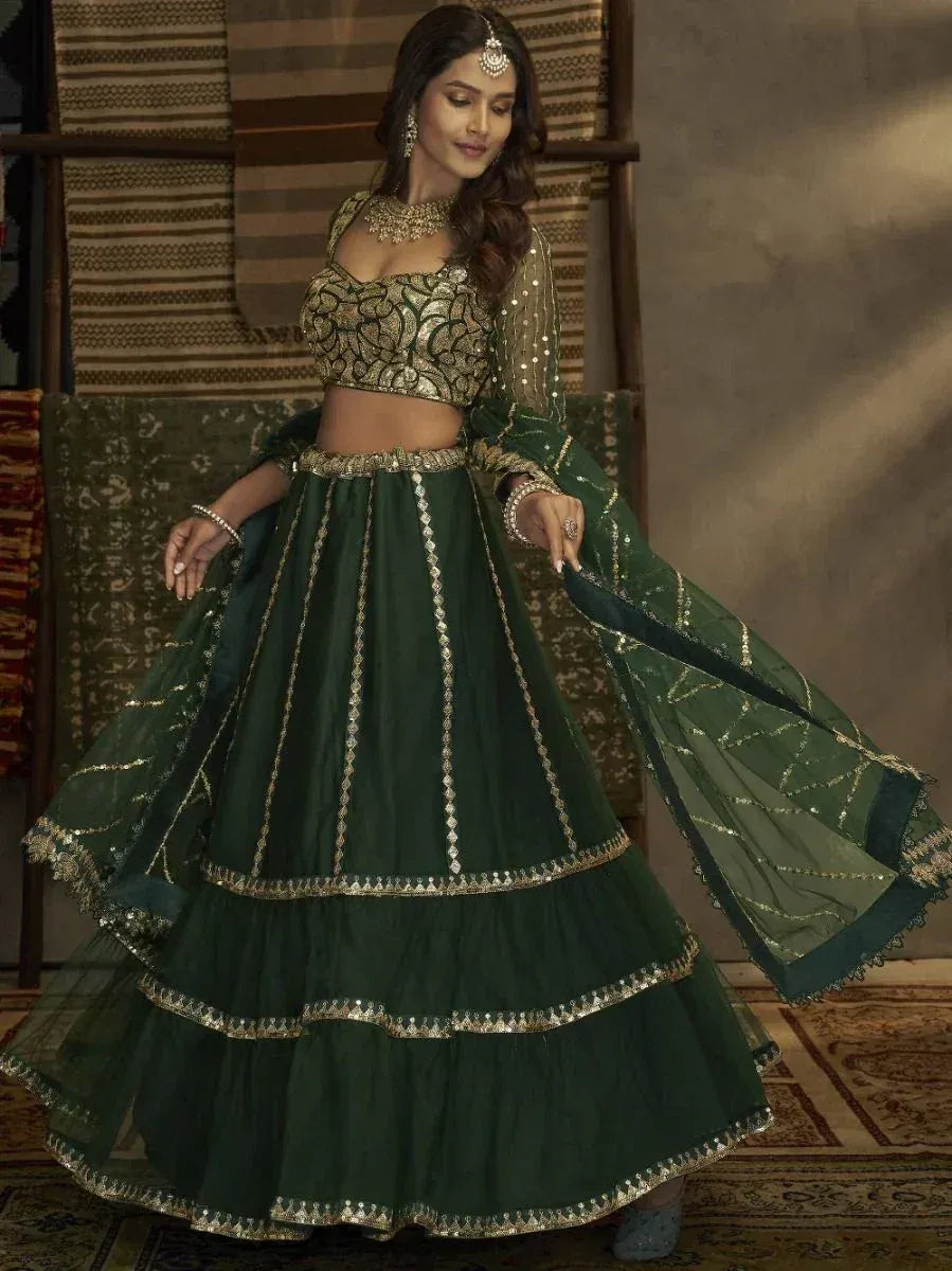 Elegant green lehenga choli with gold embroidery, perfect for Indian ethnic wear and festive occasions.
