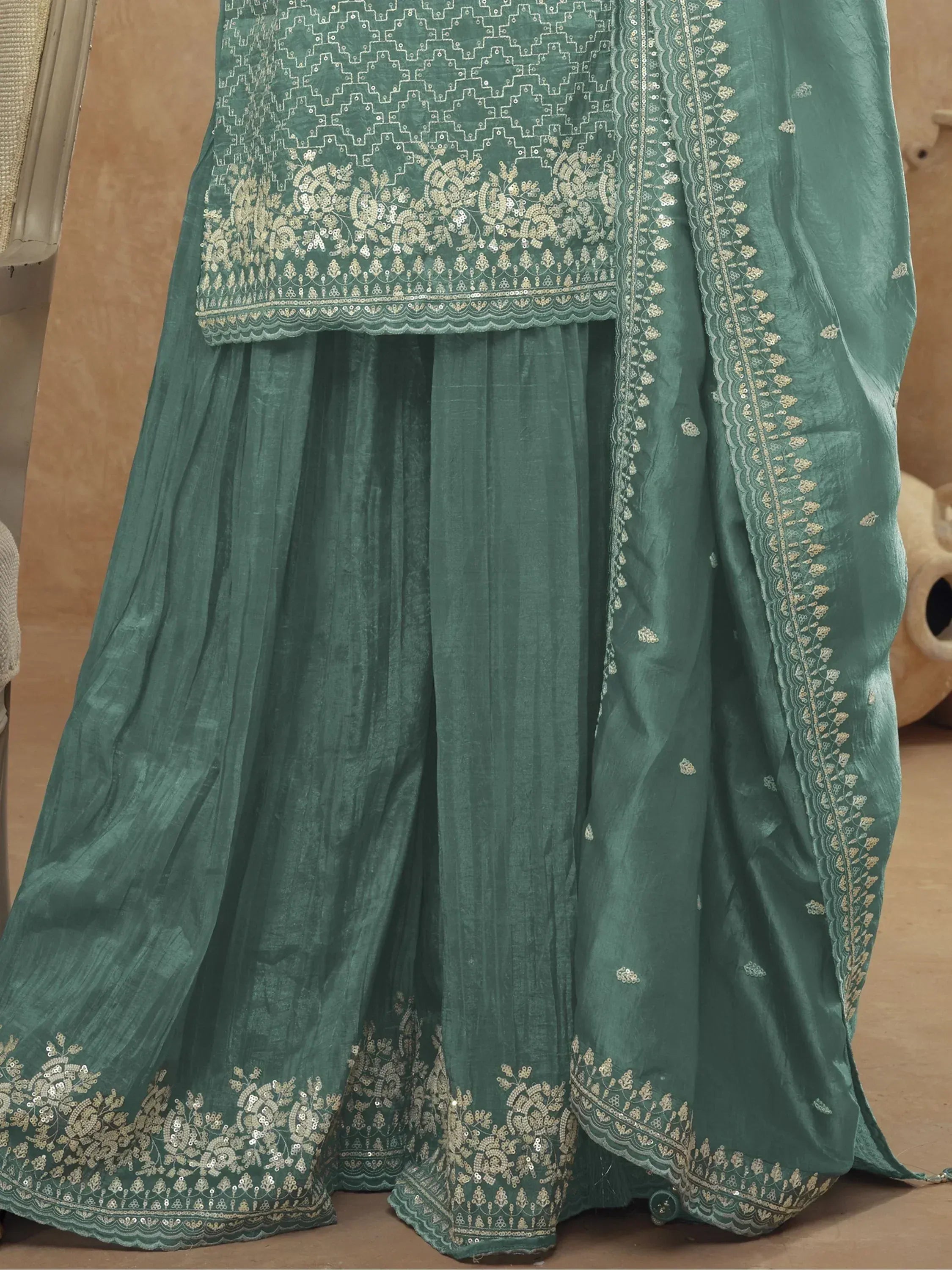 Teal green embroidered lehenga choli with gold sequin work, perfect for Indian ethnic wear occasions