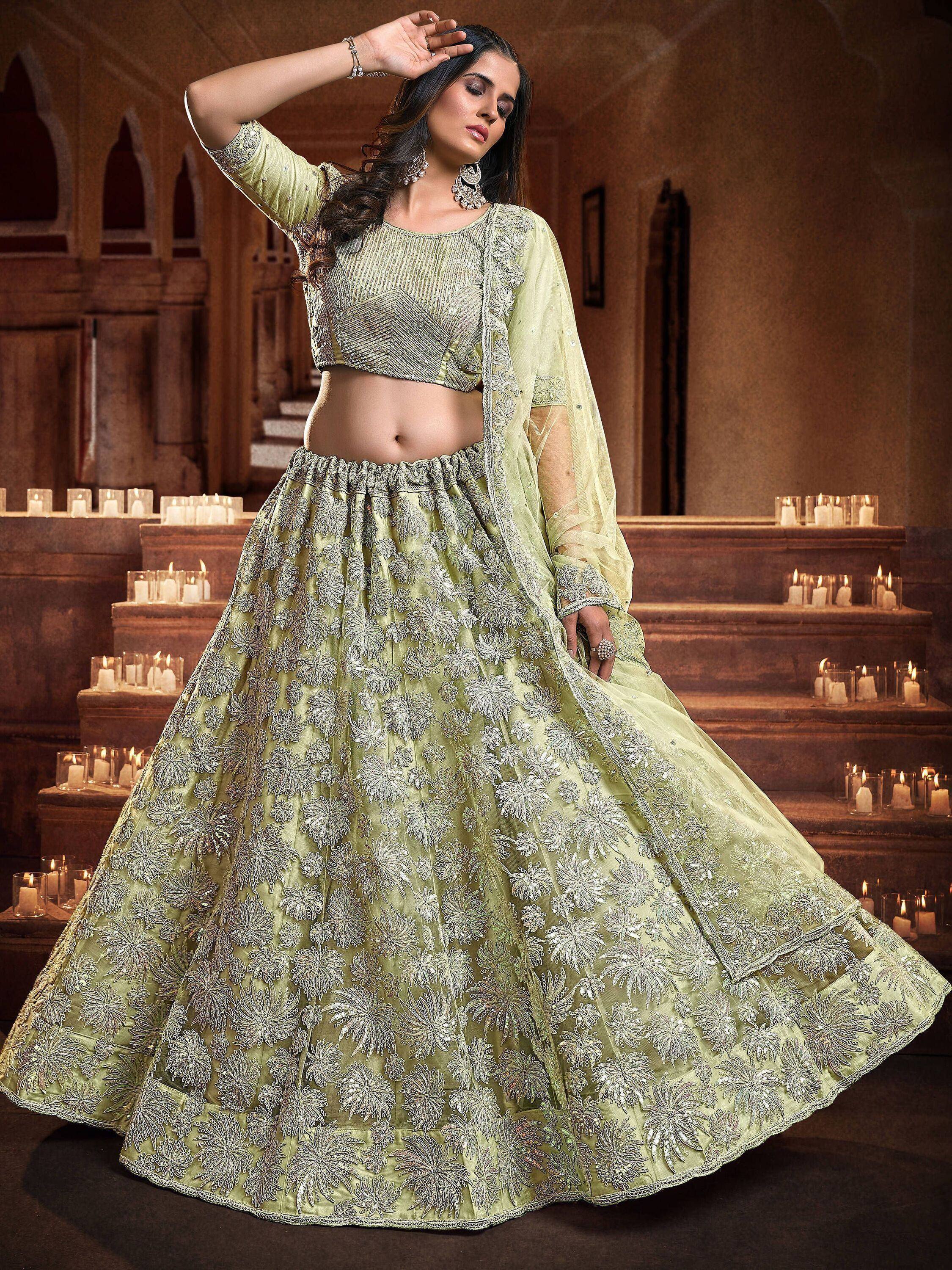 Light green embroidered lehenga choli with floral zari work, perfect for Indian weddings and festive occasions