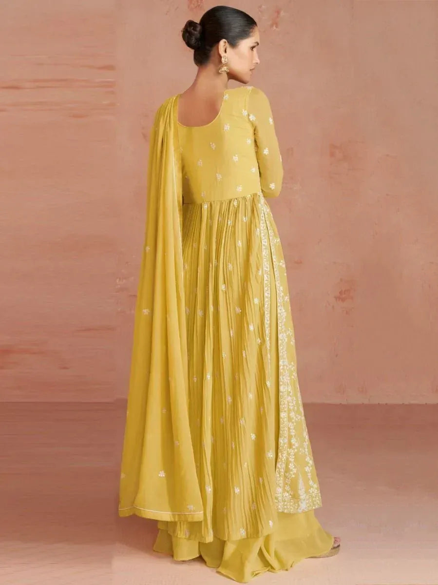 Woman in mustard yellow embroidered anarkali suit with dupatta, traditional ethnic wear