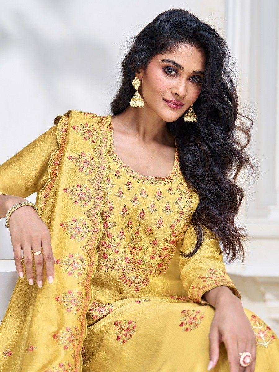 Yellow embroidered salwar kameez with floral design, perfect for ethnic occasions