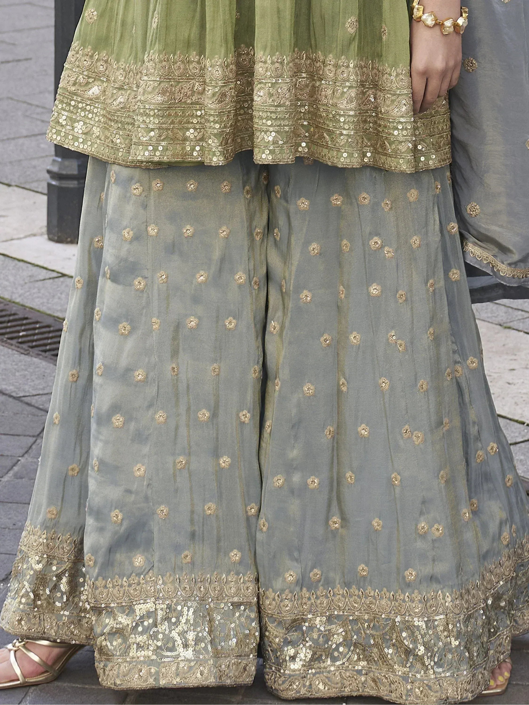 Olive green embroidered lehenga with gold sequin detailing and floral motifs, perfect for Indian ethnic wear.