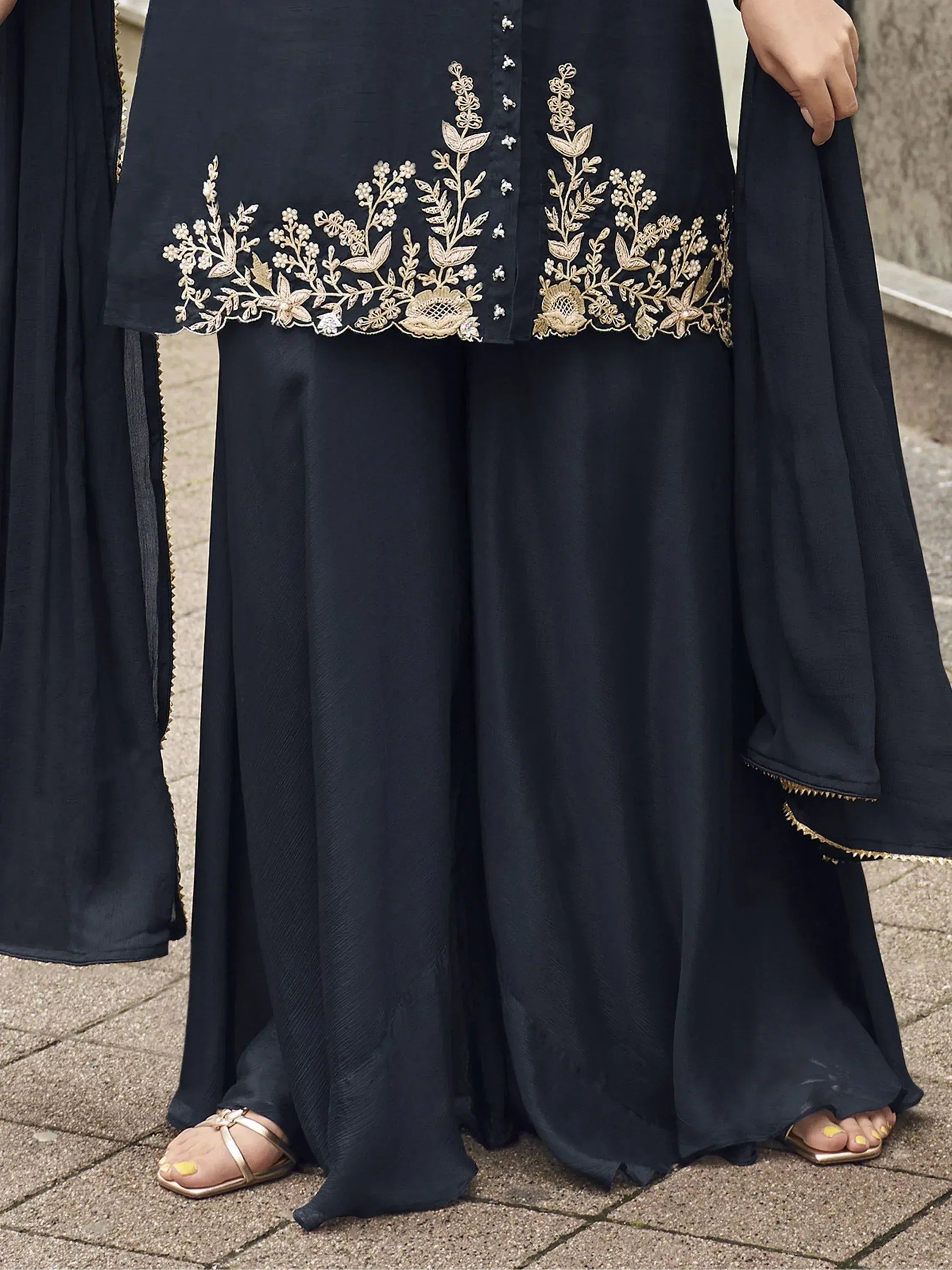 Black ethnic gown with gold floral embroidery, perfect for Indian wear occasions