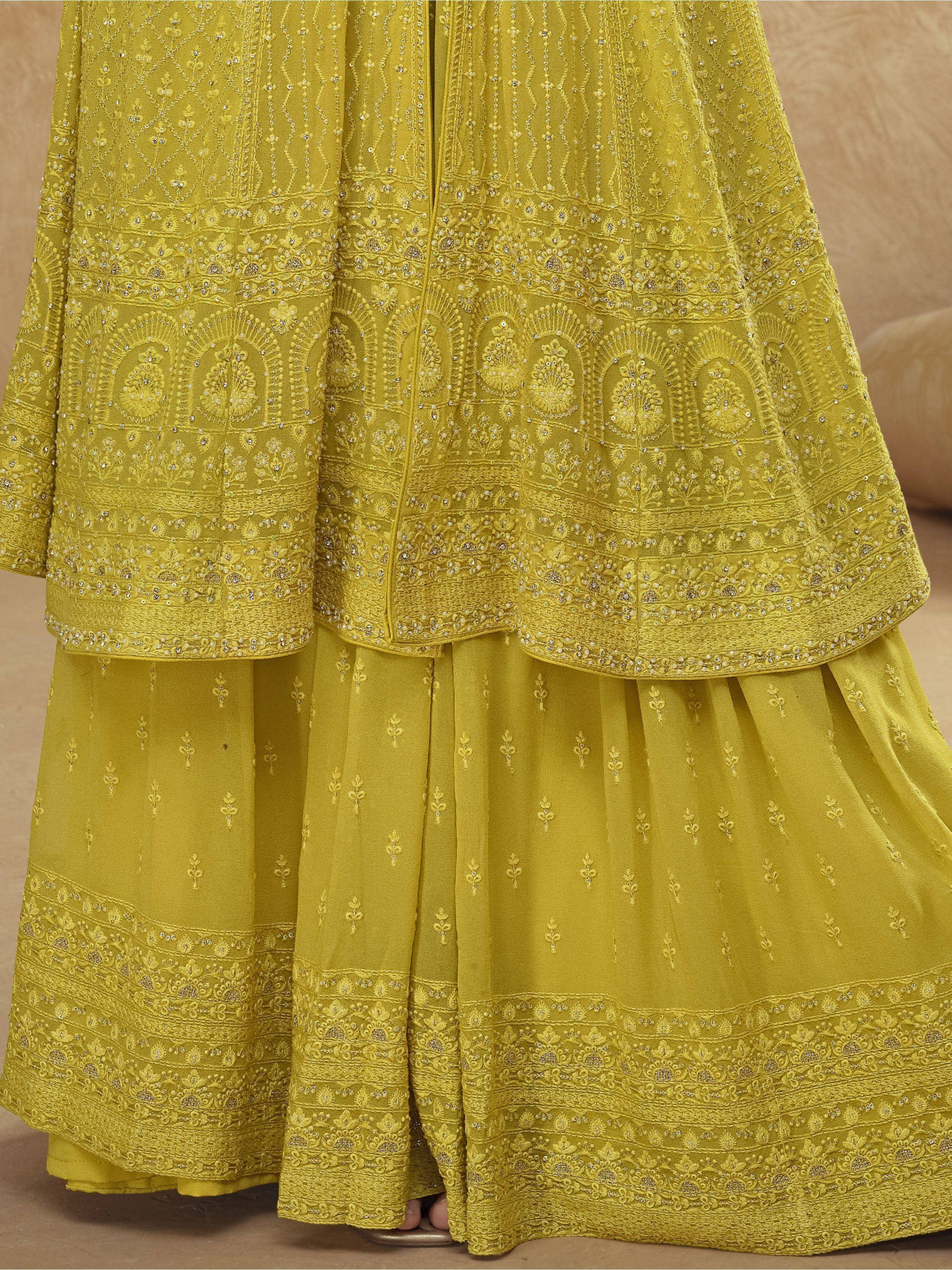 Yellow embroidered lehenga choli with intricate floral patterns and embellishments
