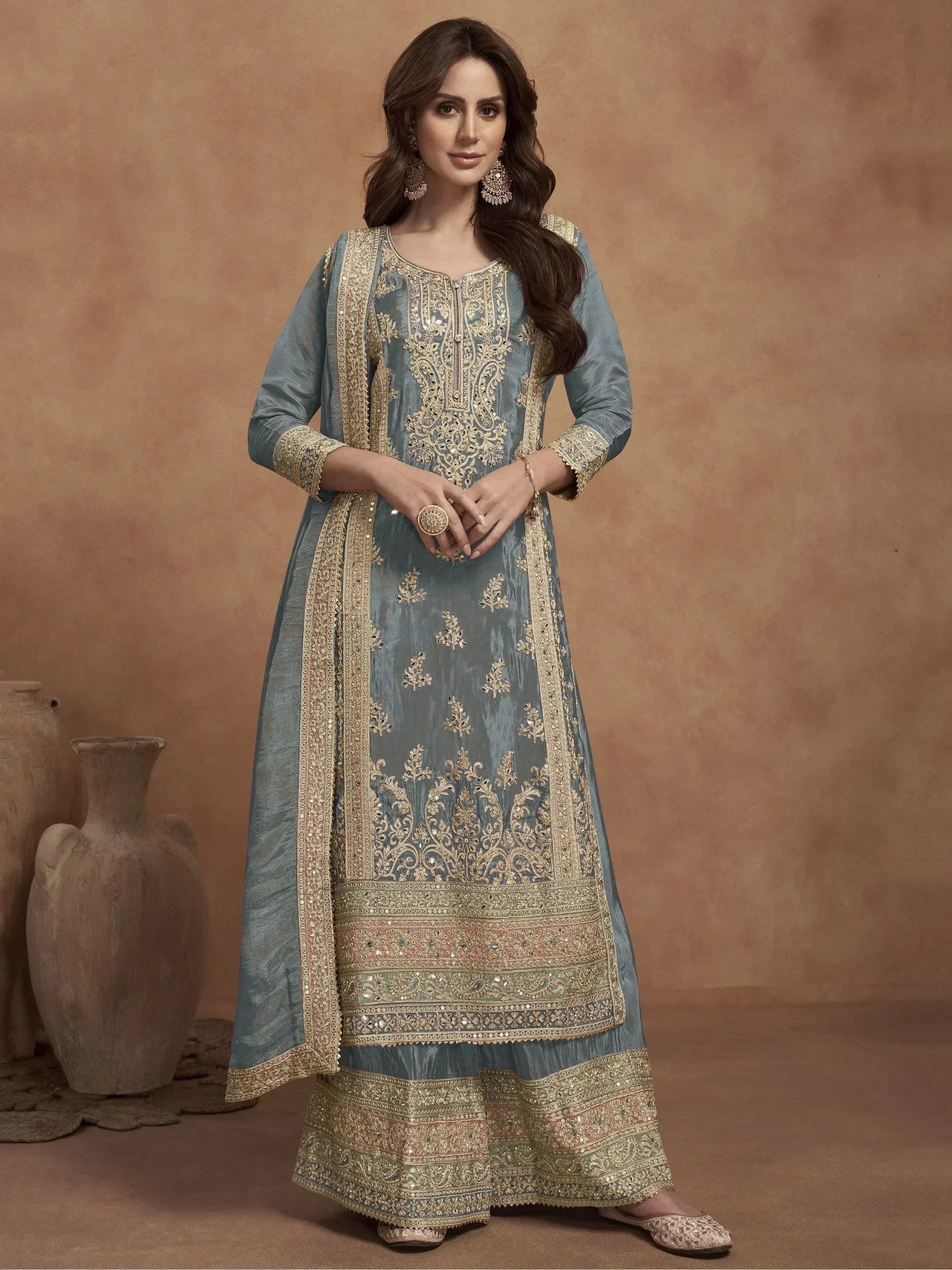 Elegant blue designer salwar kameez with gold embroidery and traditional Indian wear details