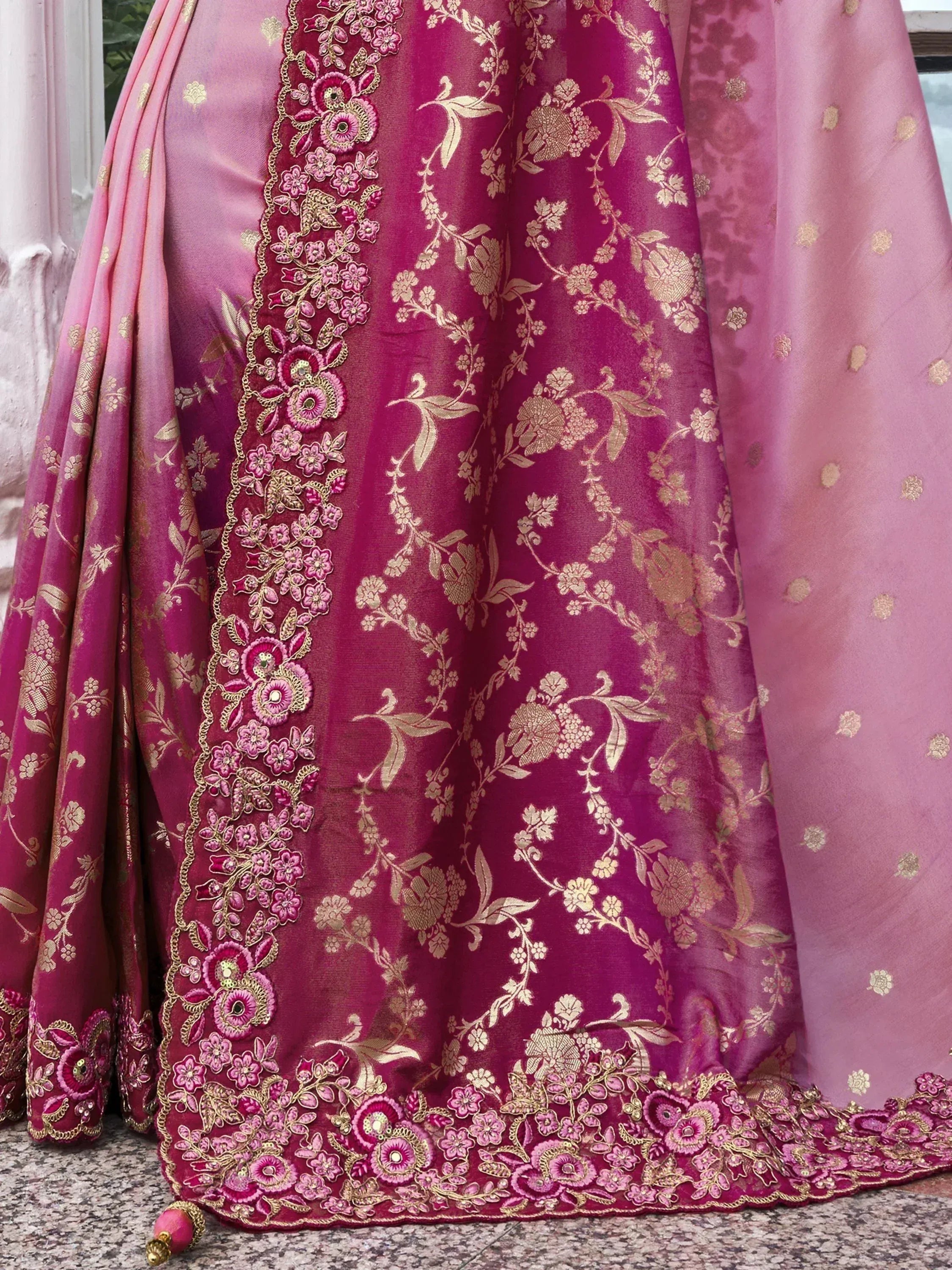 Pink and gold embroidered lehenga choli with floral motifs and intricate border detailing