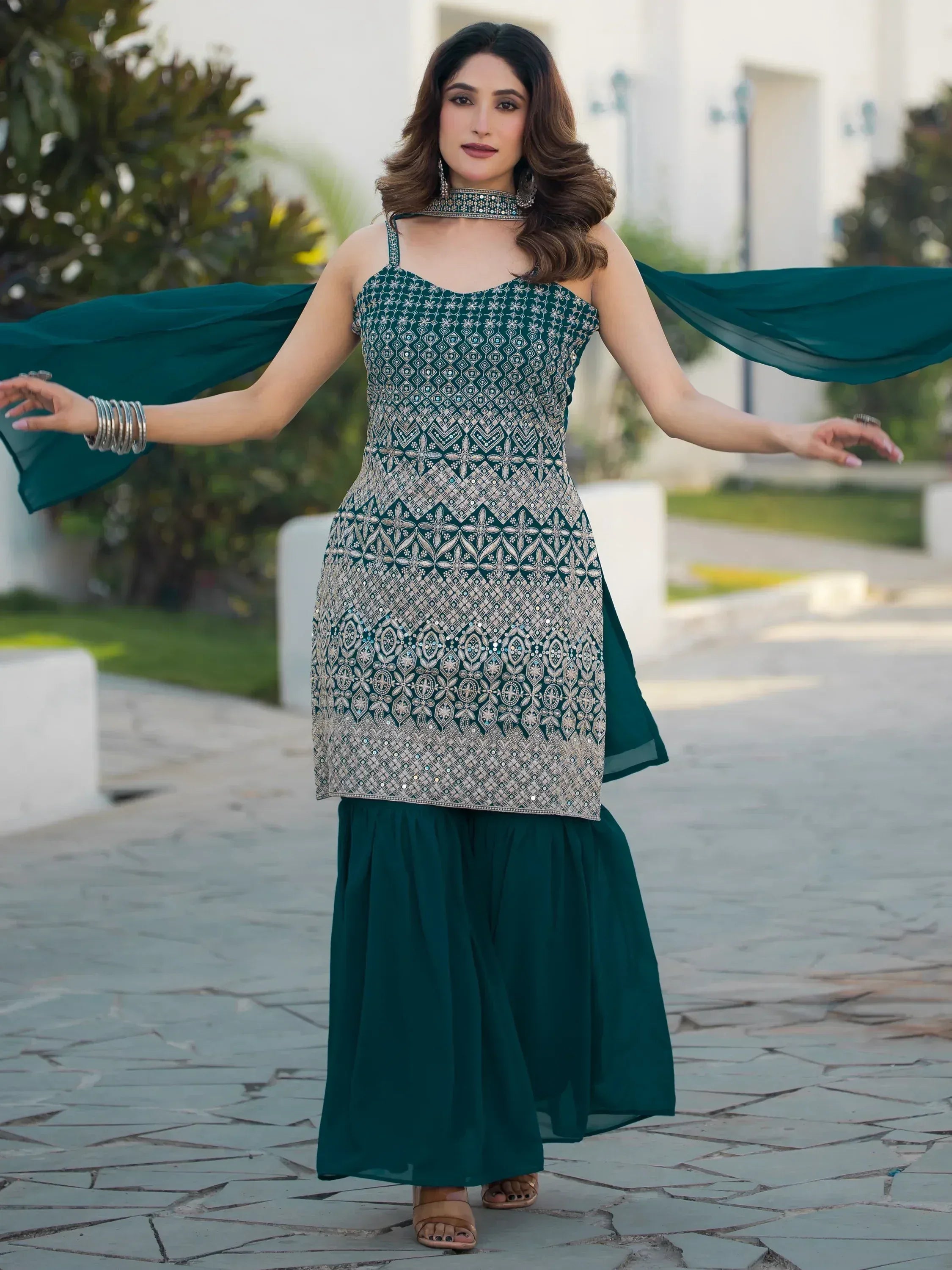 Emerald green embroidered ethnic gown with matching dupatta, perfect for Indian occasions and festive wear.