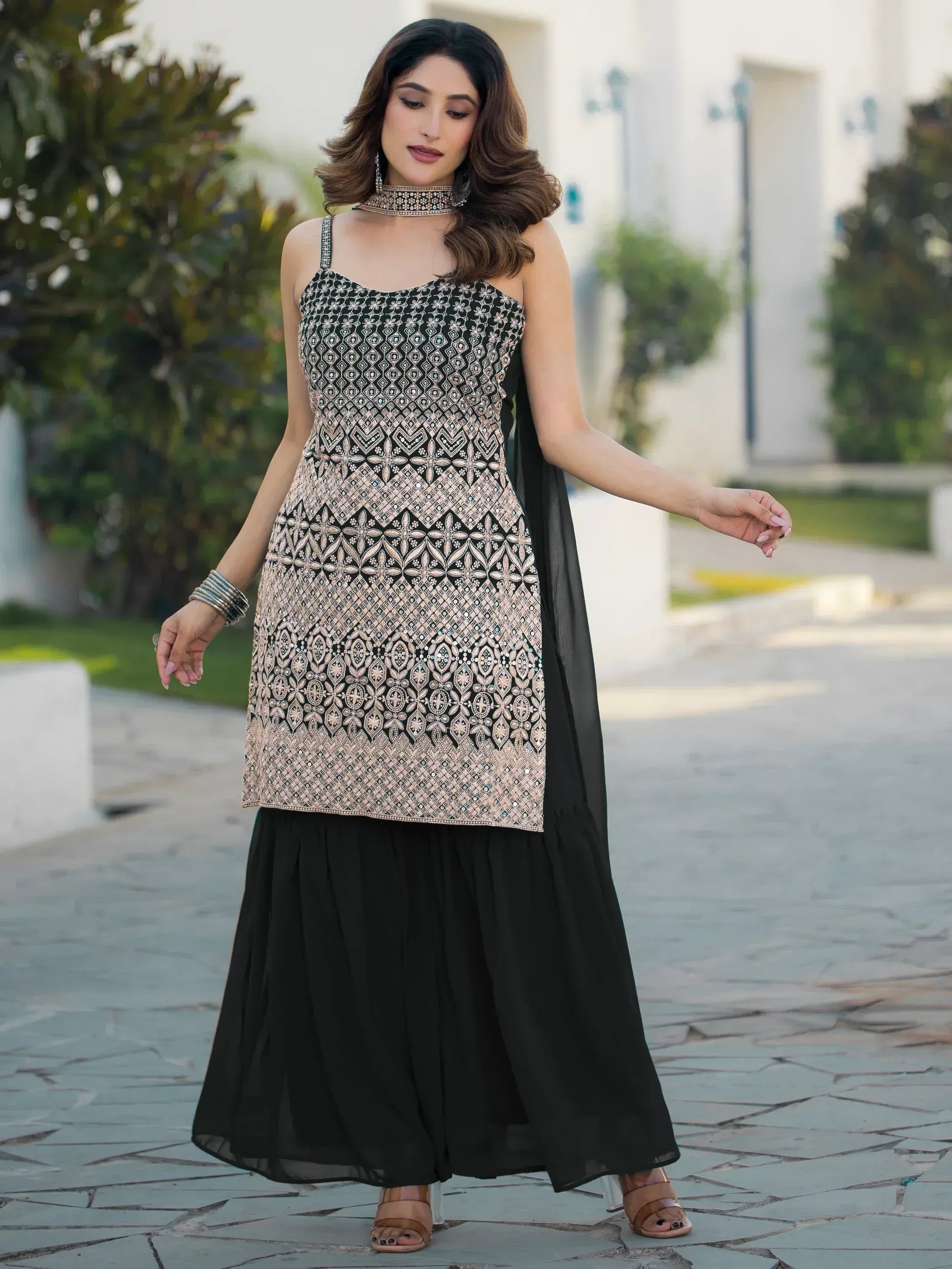 Black and gold embroidered ethnic gown with matching dupatta, perfect for Indian festive occasions.