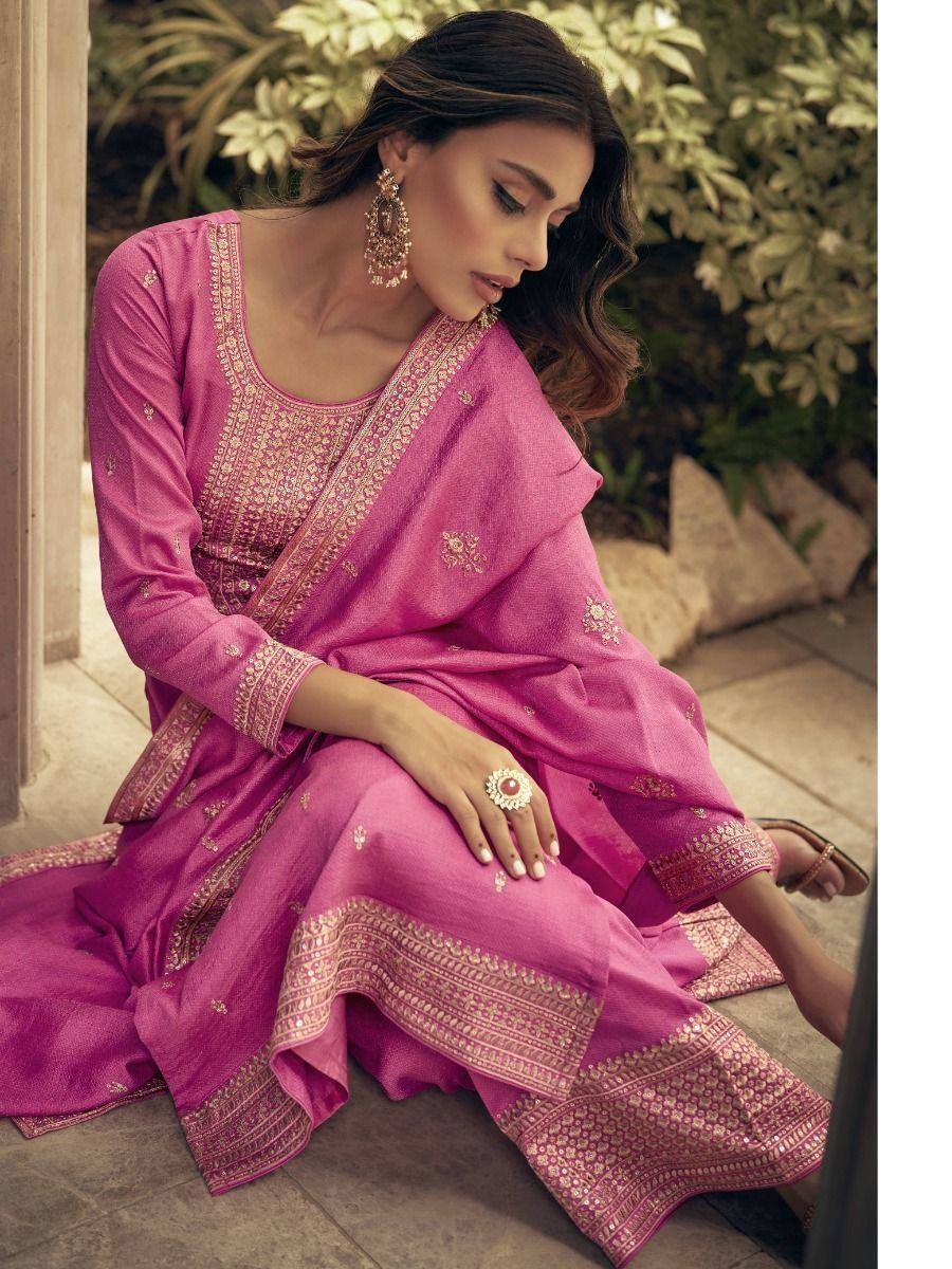 Pink embroidered salwar kameez with gold detailing, perfect for ethnic occasions and festive wear.