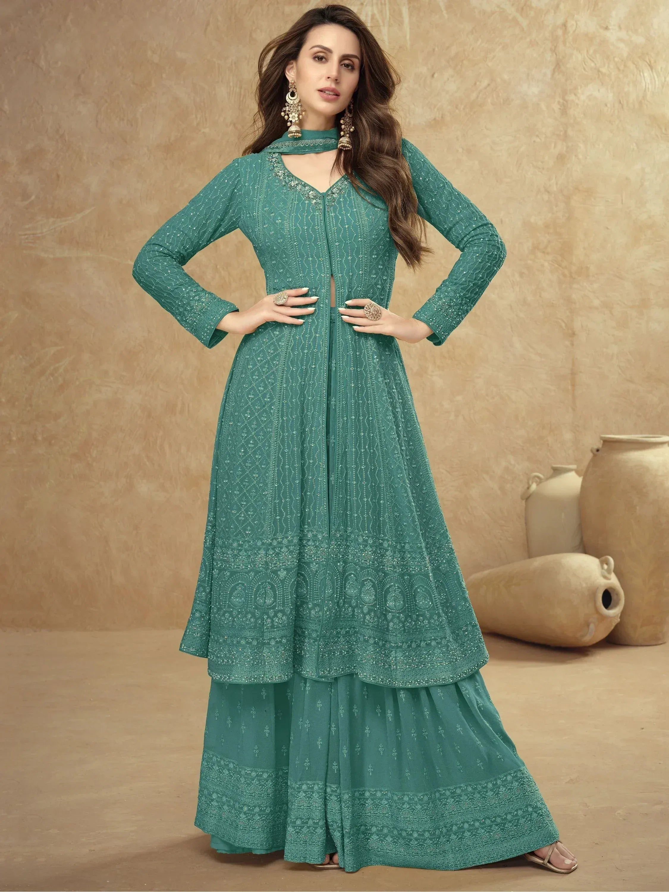 Teal embroidered anarkali suit with layered skirt and matching dupatta, perfect for Indian ethnic wear.