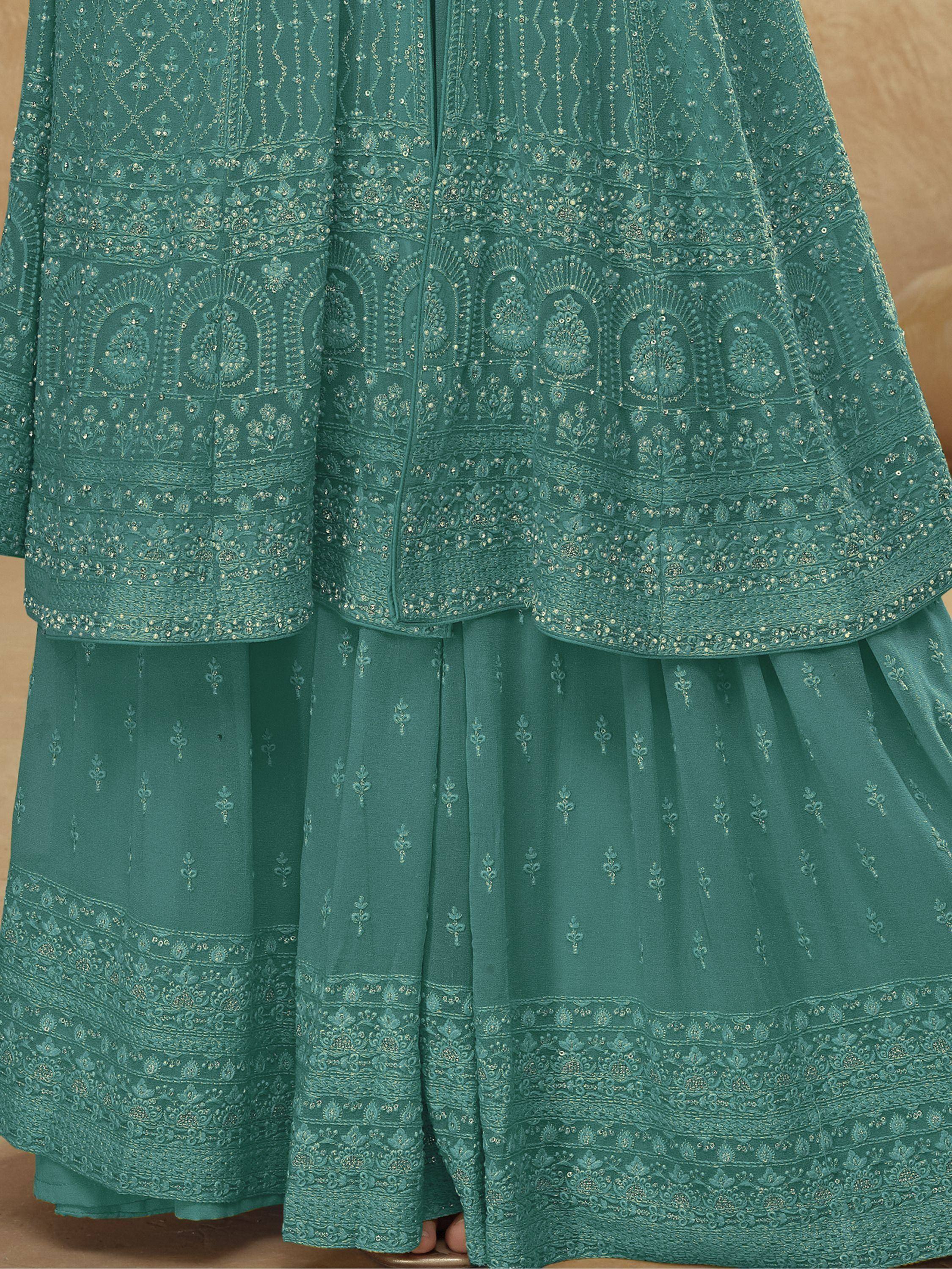 Teal embroidered lehenga choli with intricate gold detailing and layered skirt, perfect for ethnic occasions