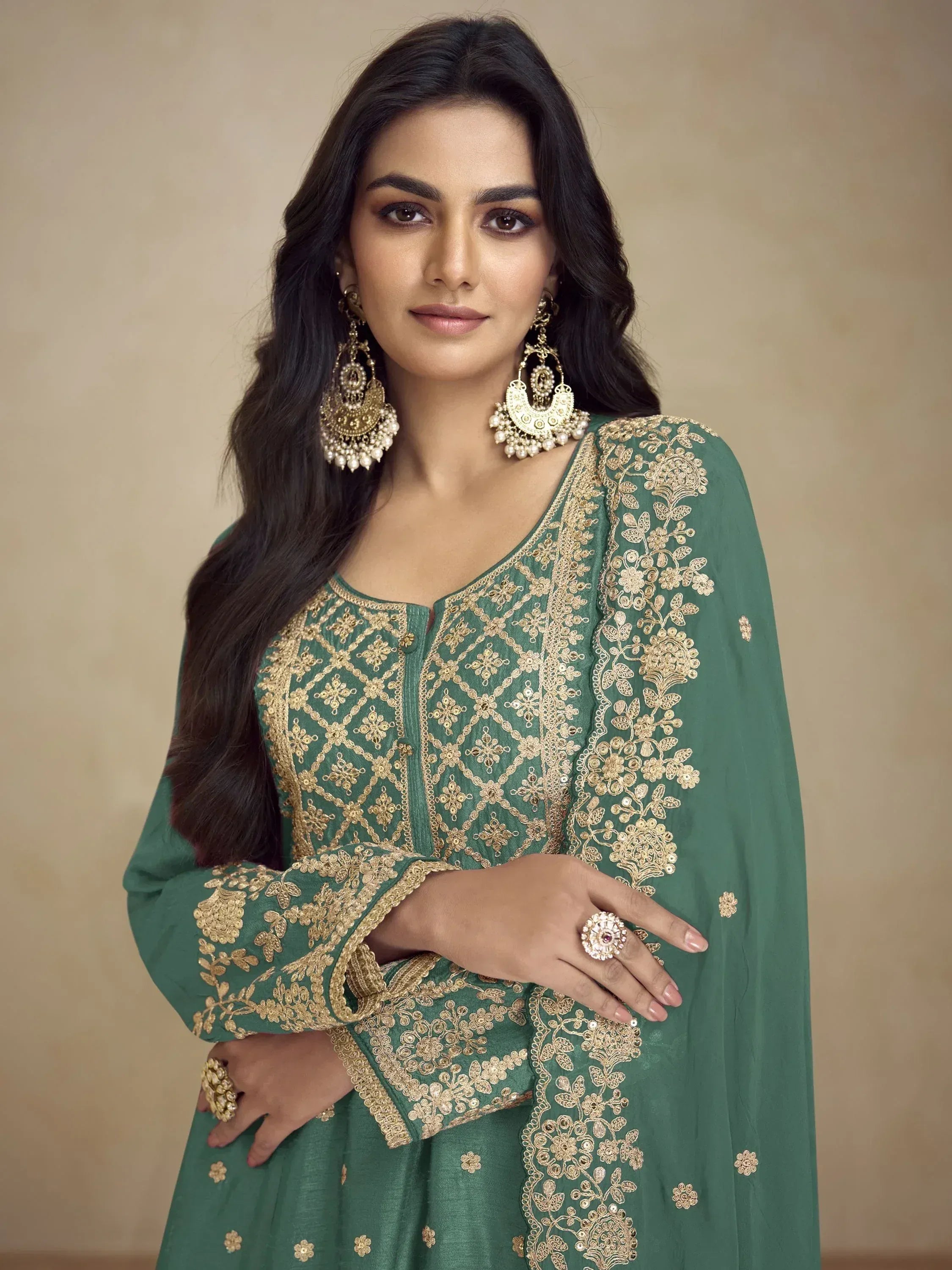 Green ethnic gown with gold embroidery, perfect for Indian occasions and festive wear.
