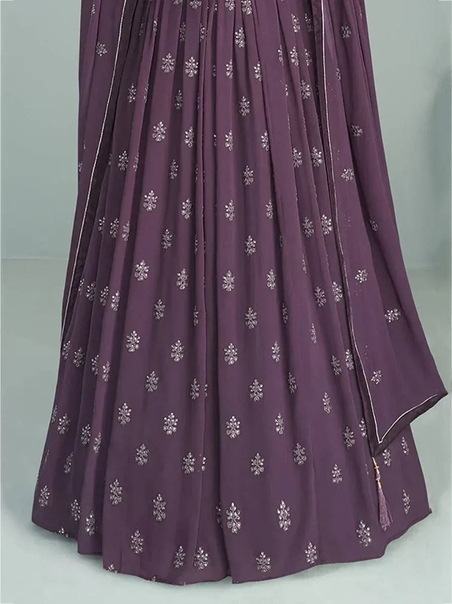 Purple pleated lehenga with silver floral embroidery and tassel detail, ideal for ethnic occasions