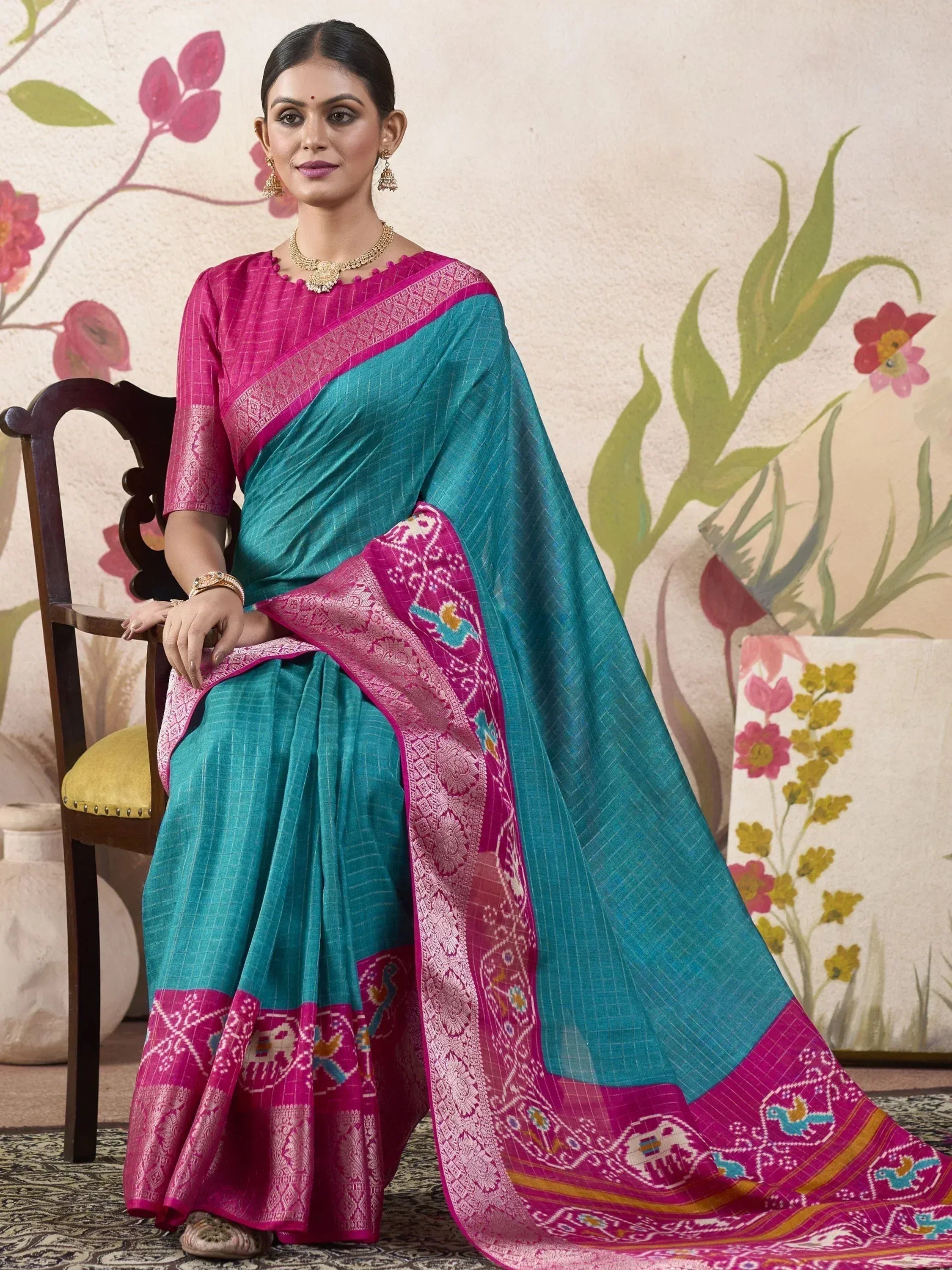 Teal and magenta ethnic saree with intricate Ikat border, perfect for Indian occasions and festive wear.