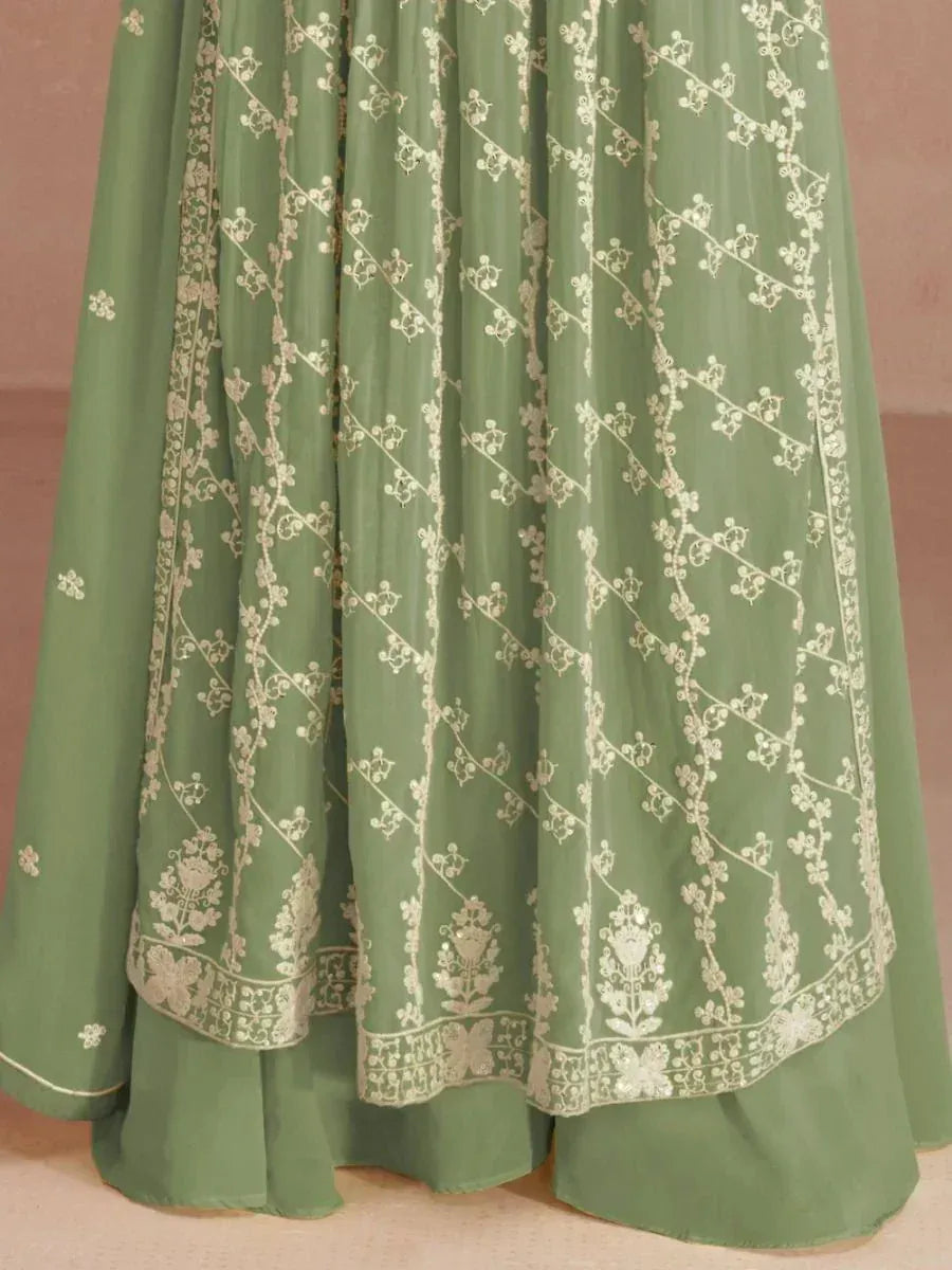 Green lehenga skirt with white floral embroidery, traditional Indian ethnic wear