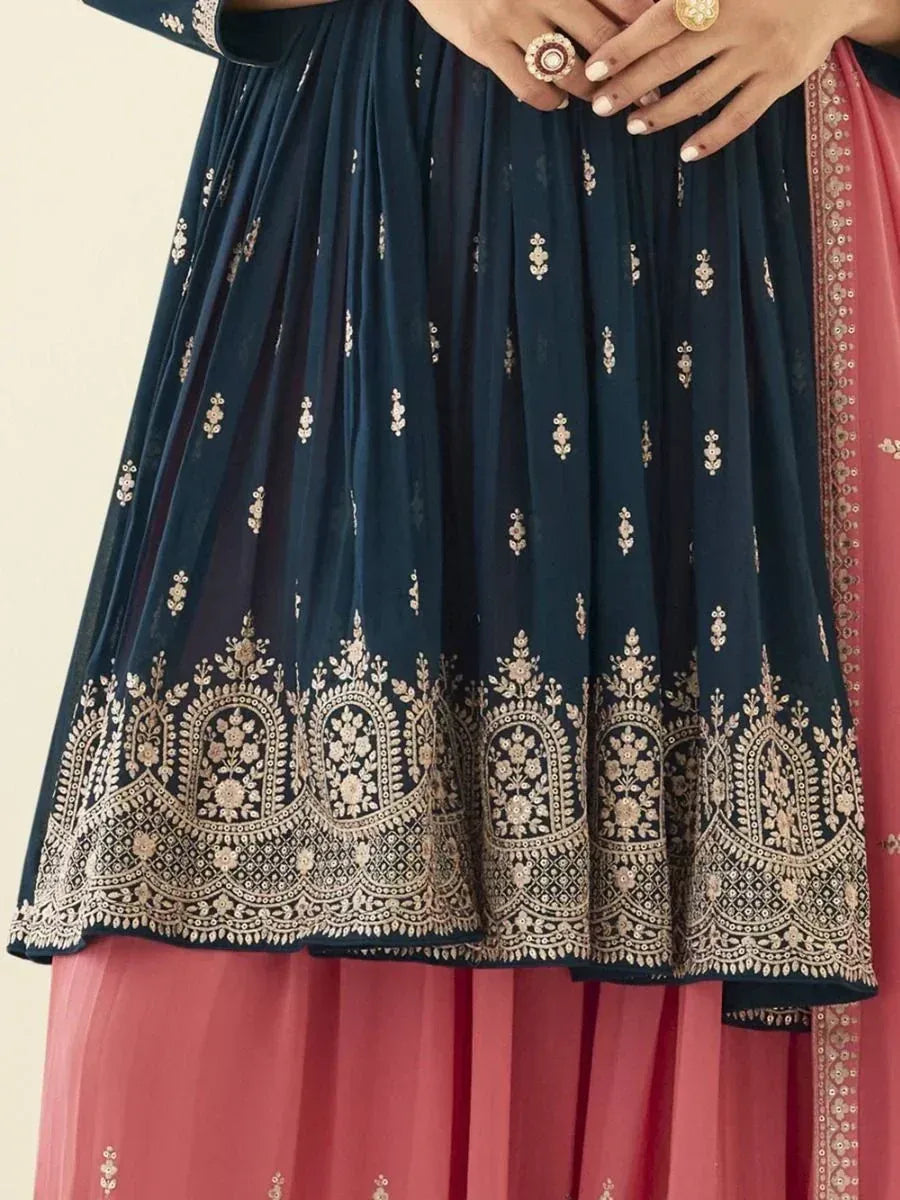 Navy blue embroidered ethnic gown with floral gold detailing and pink dupatta