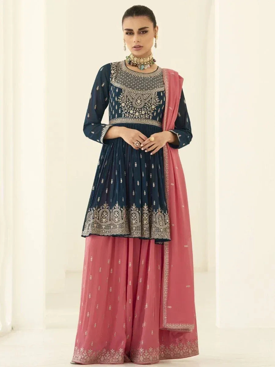 Woman wearing navy blue embroidered kurti with pink palazzo pants and dupatta, Indian ethnic set