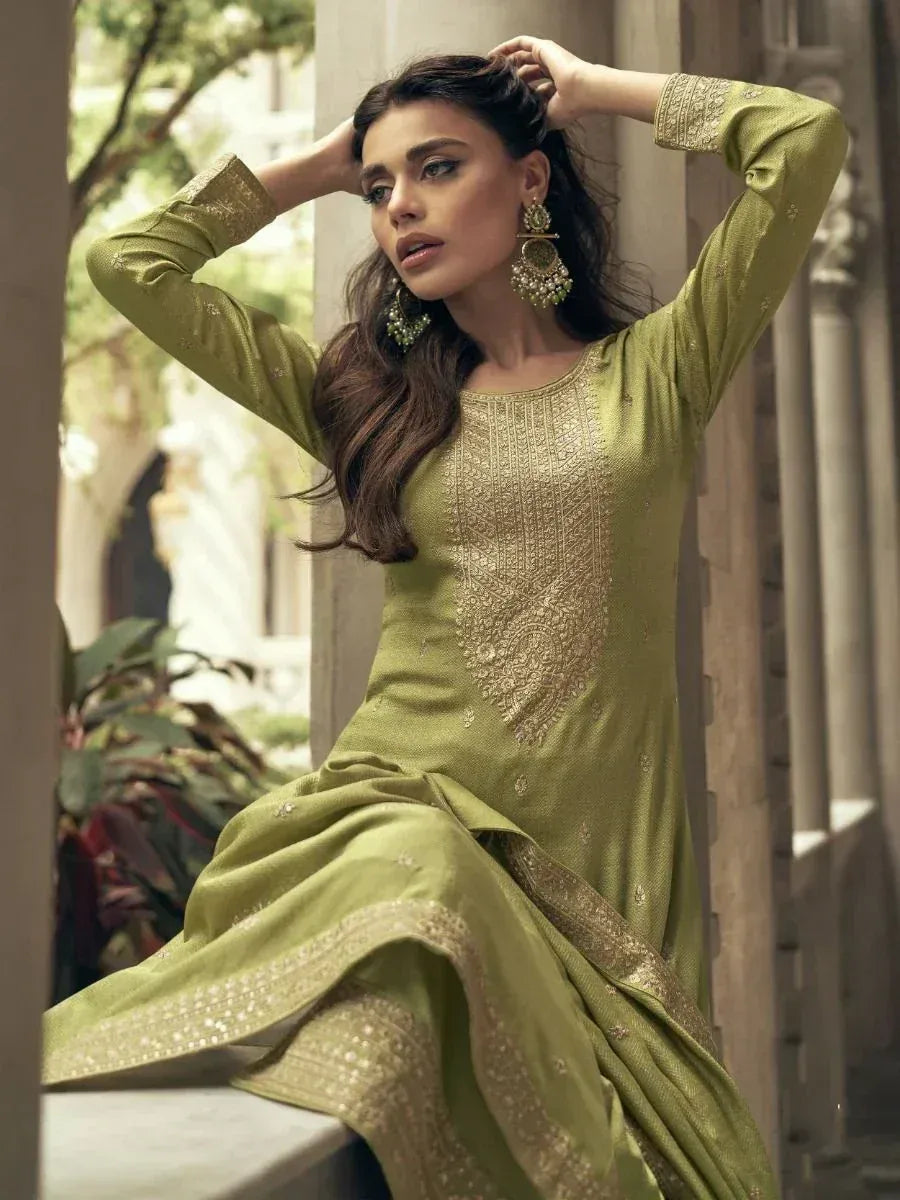 Olive green ethnic gown with gold embroidery, perfect for Indian festive occasions and weddings.