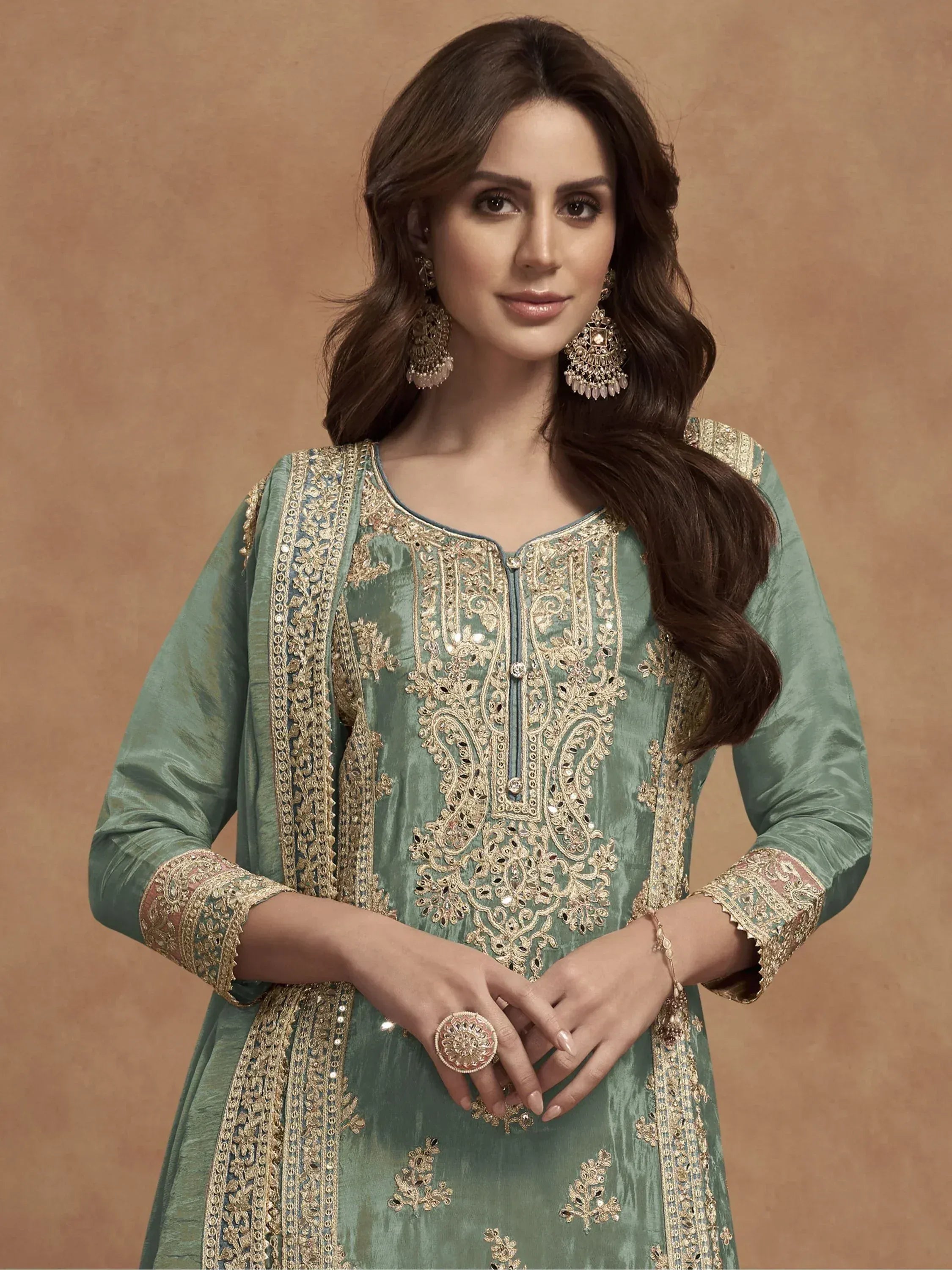 Mint green embroidered ethnic kurta with gold detailing, perfect for Indian festive occasions