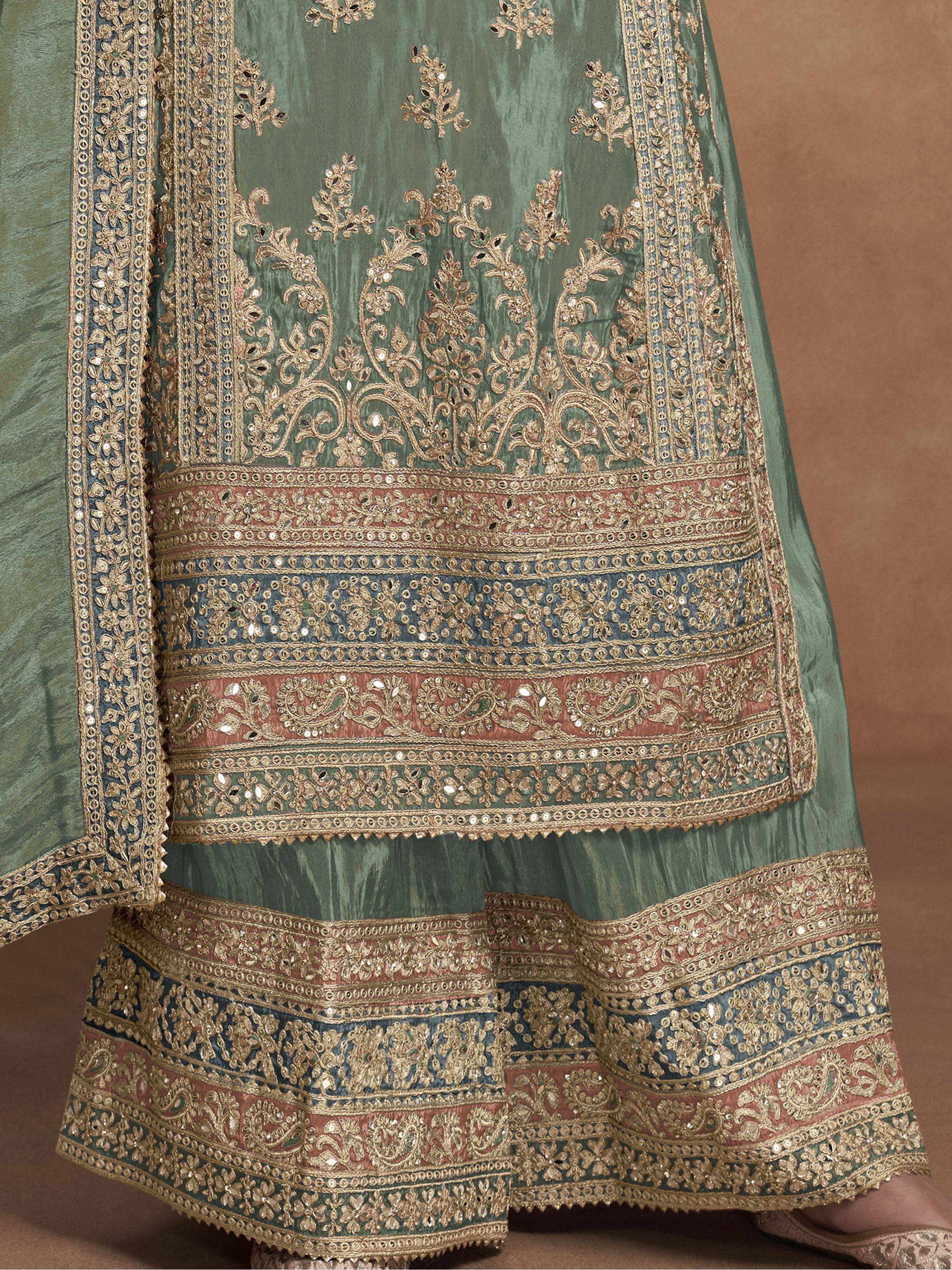 Elegant green lehenga with intricate gold embroidery and colorful border detailing for Indian ethnic wear.