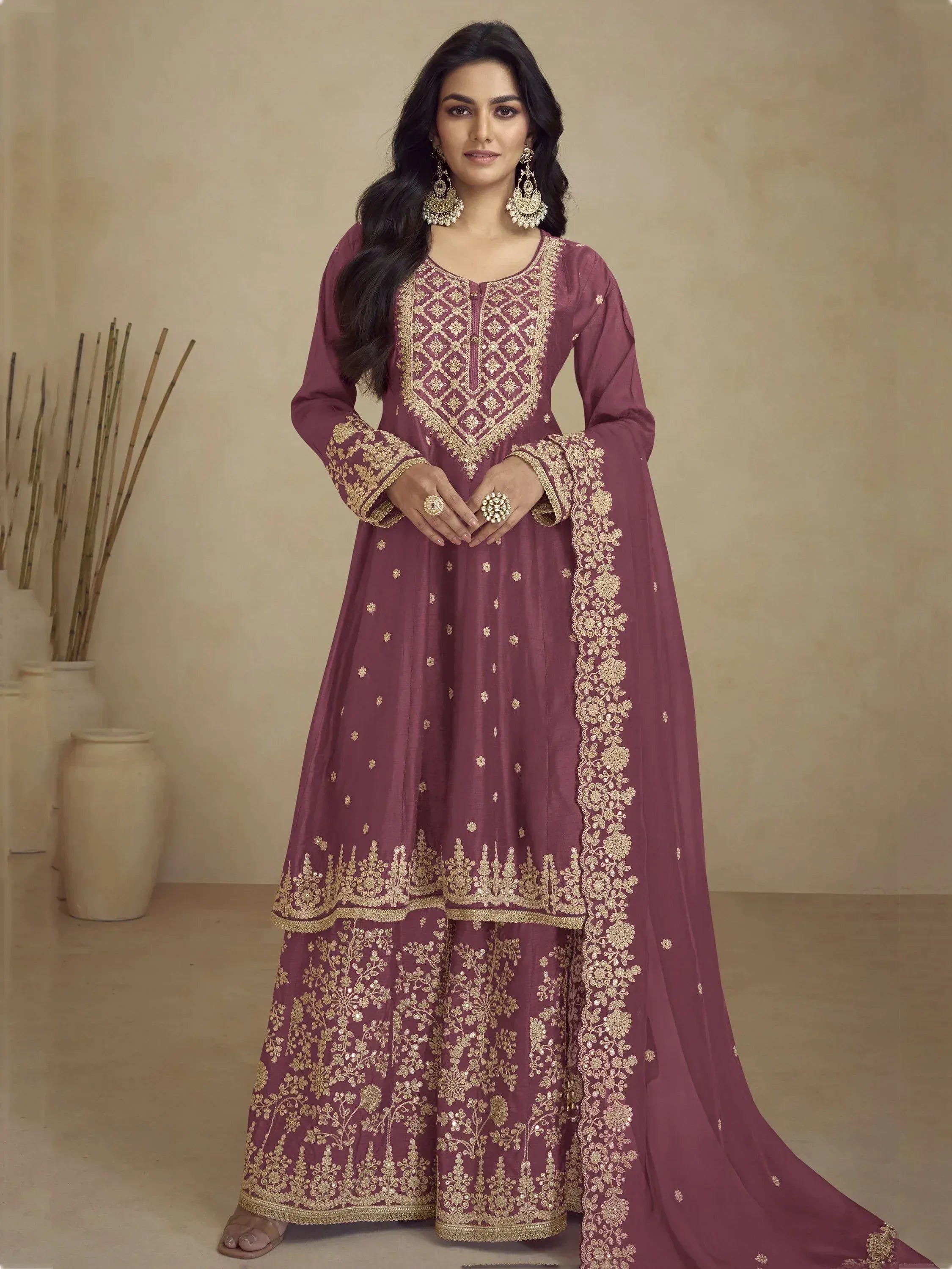 Elegant maroon ethnic anarkali with gold embroidery, perfect for Indian weddings and festive occasions.