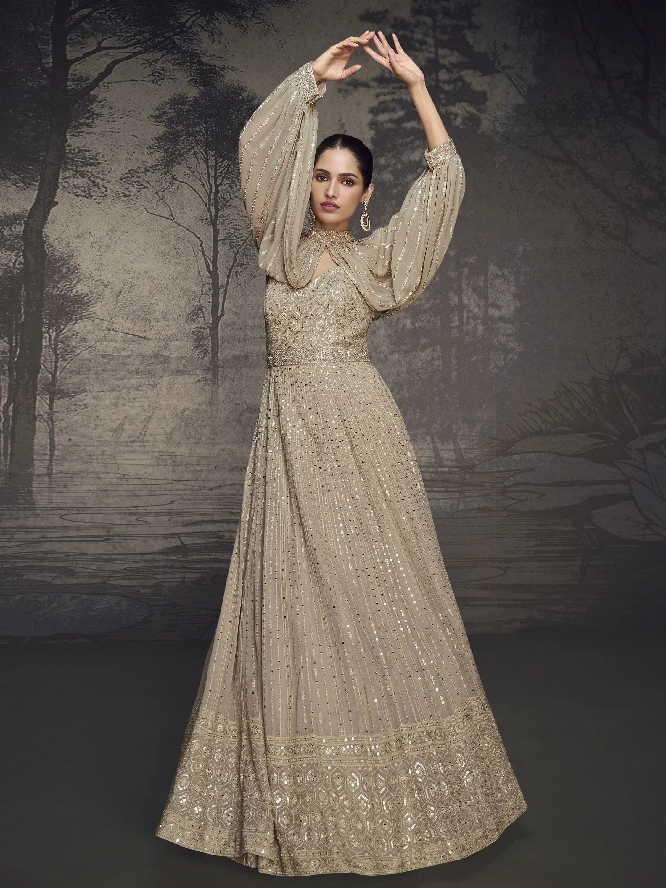 Elegant beige ethnic gown with sequin detailing and flared sleeves for festive occasions