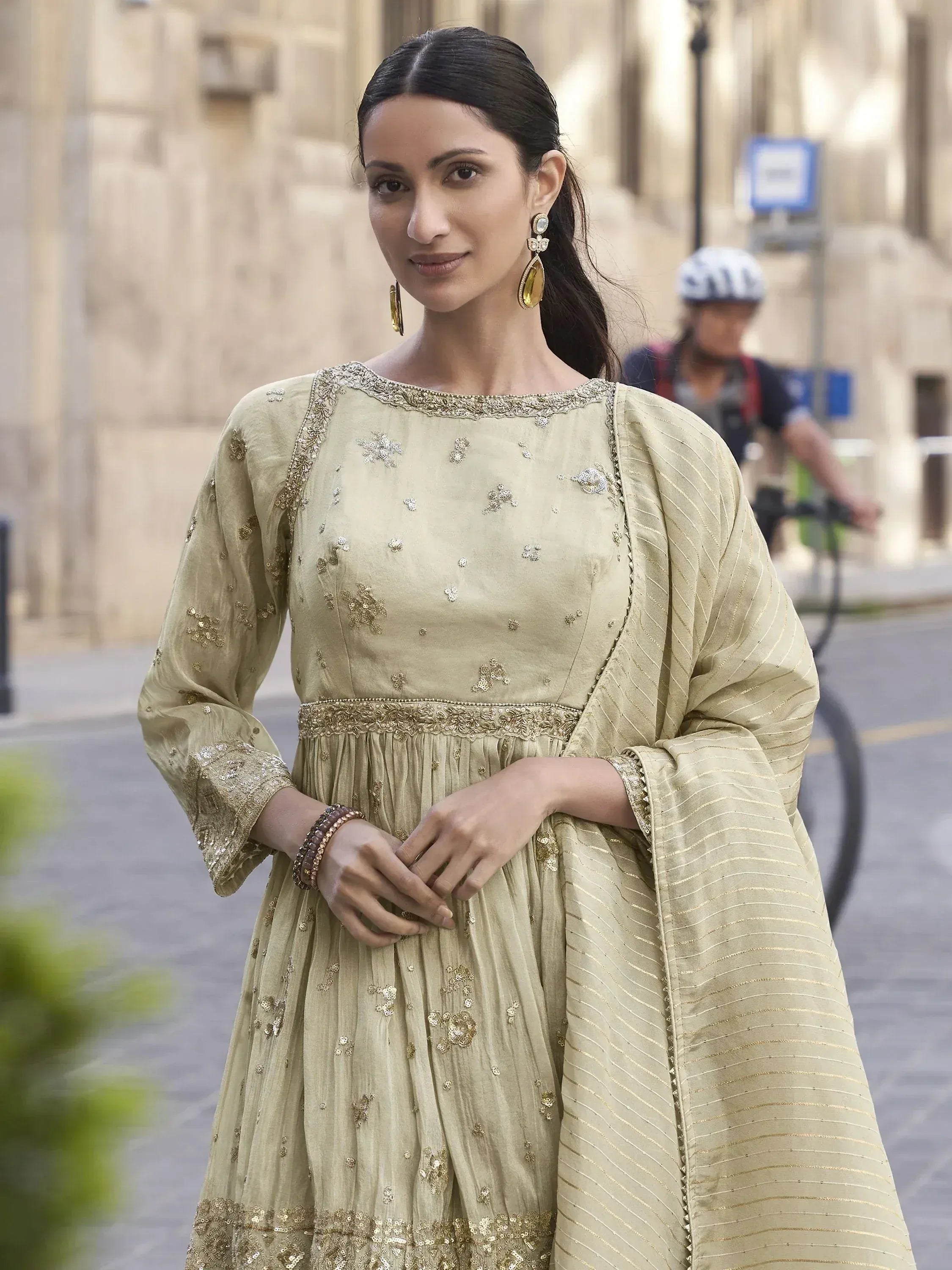 Elegant olive green embroidered anarkali suit with gold detailing, perfect for Indian ethnic occasions.