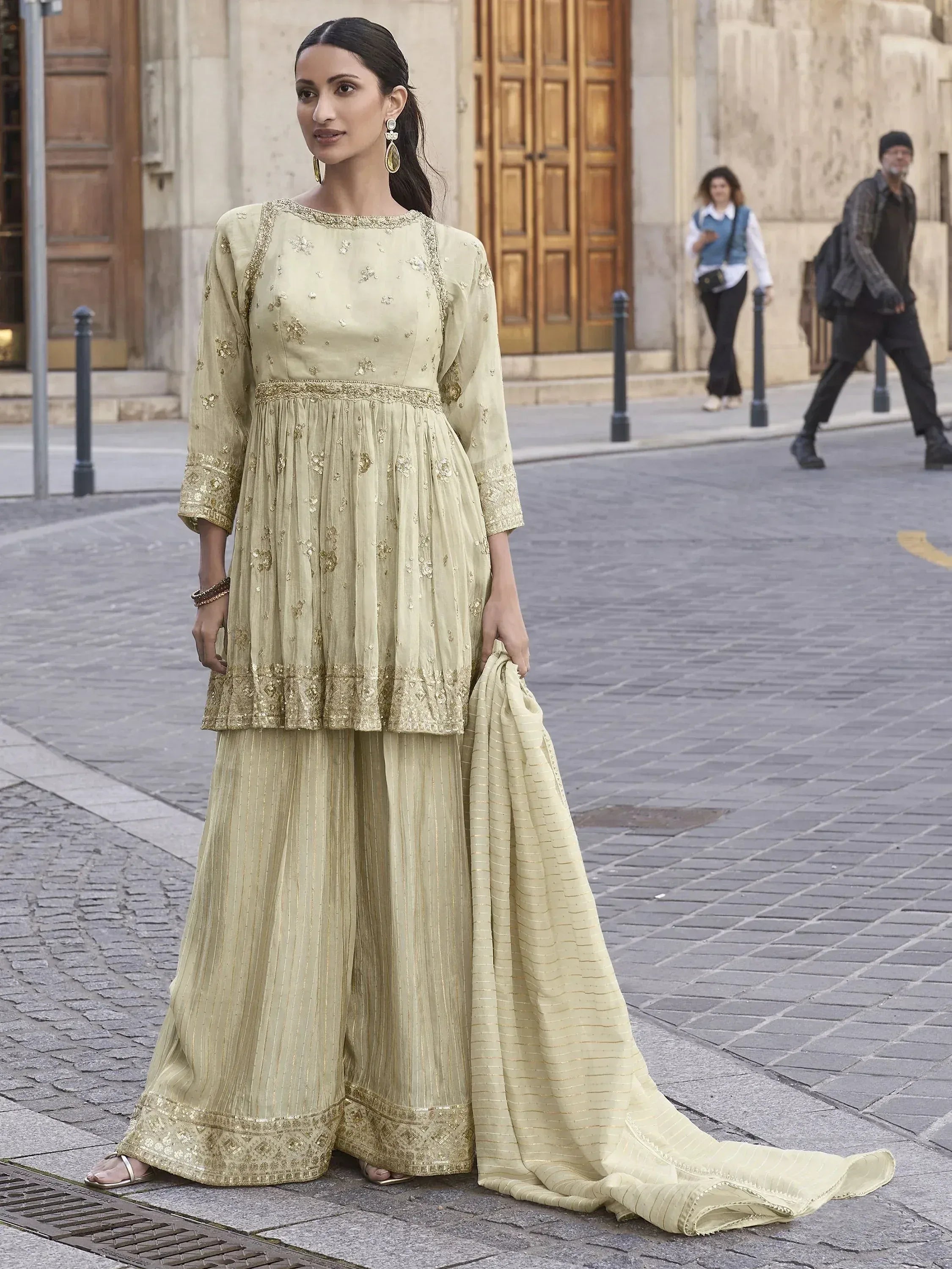 Elegant light green ethnic salwar kameez with gold embroidery, perfect for festive occasions