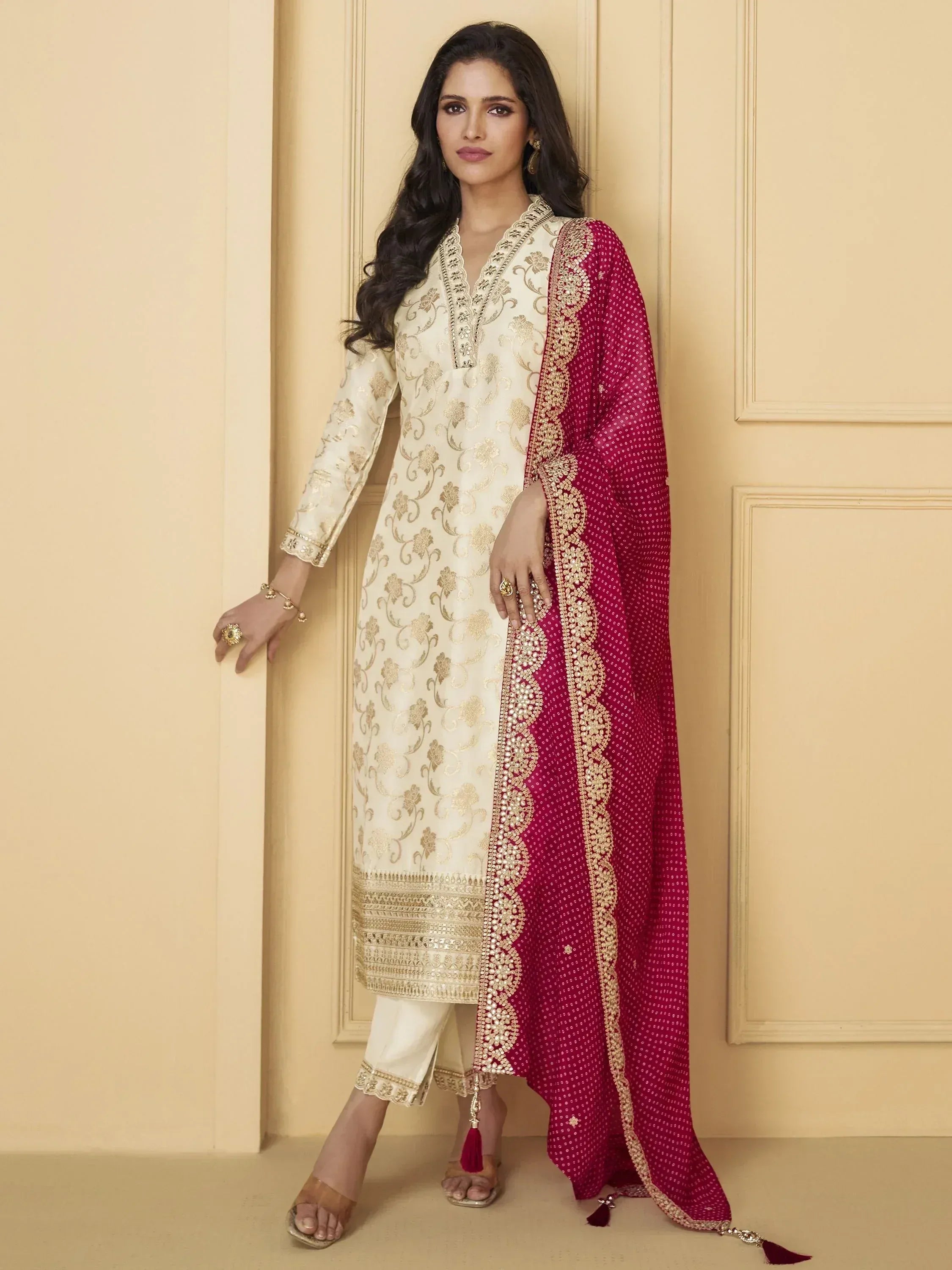 Elegant cream and maroon embroidered salwar kameez with gold detailing, perfect for Indian ethnic wear.