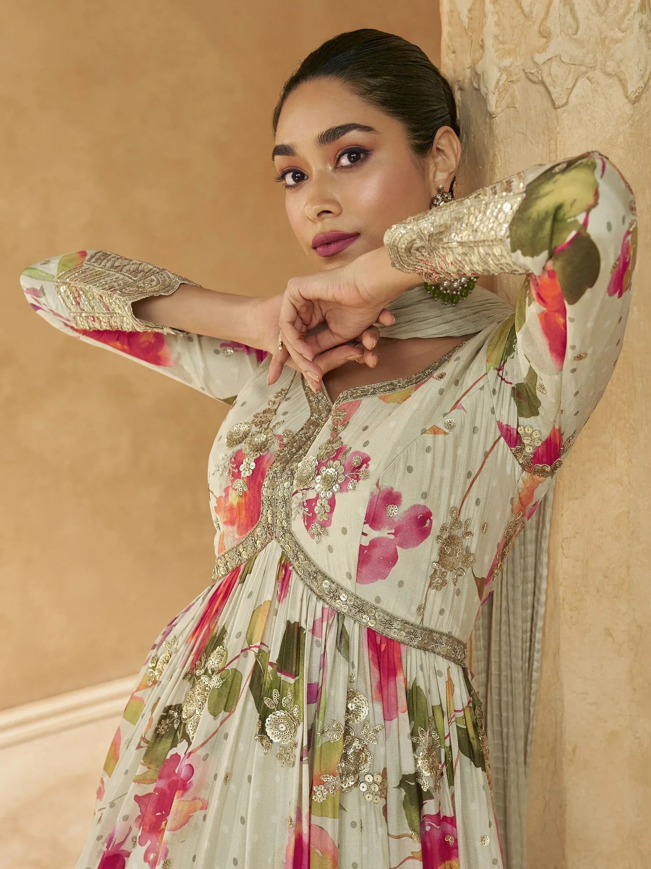 Floral printed ethnic gown with gold embroidery, perfect for Indian occasions and festive wear.