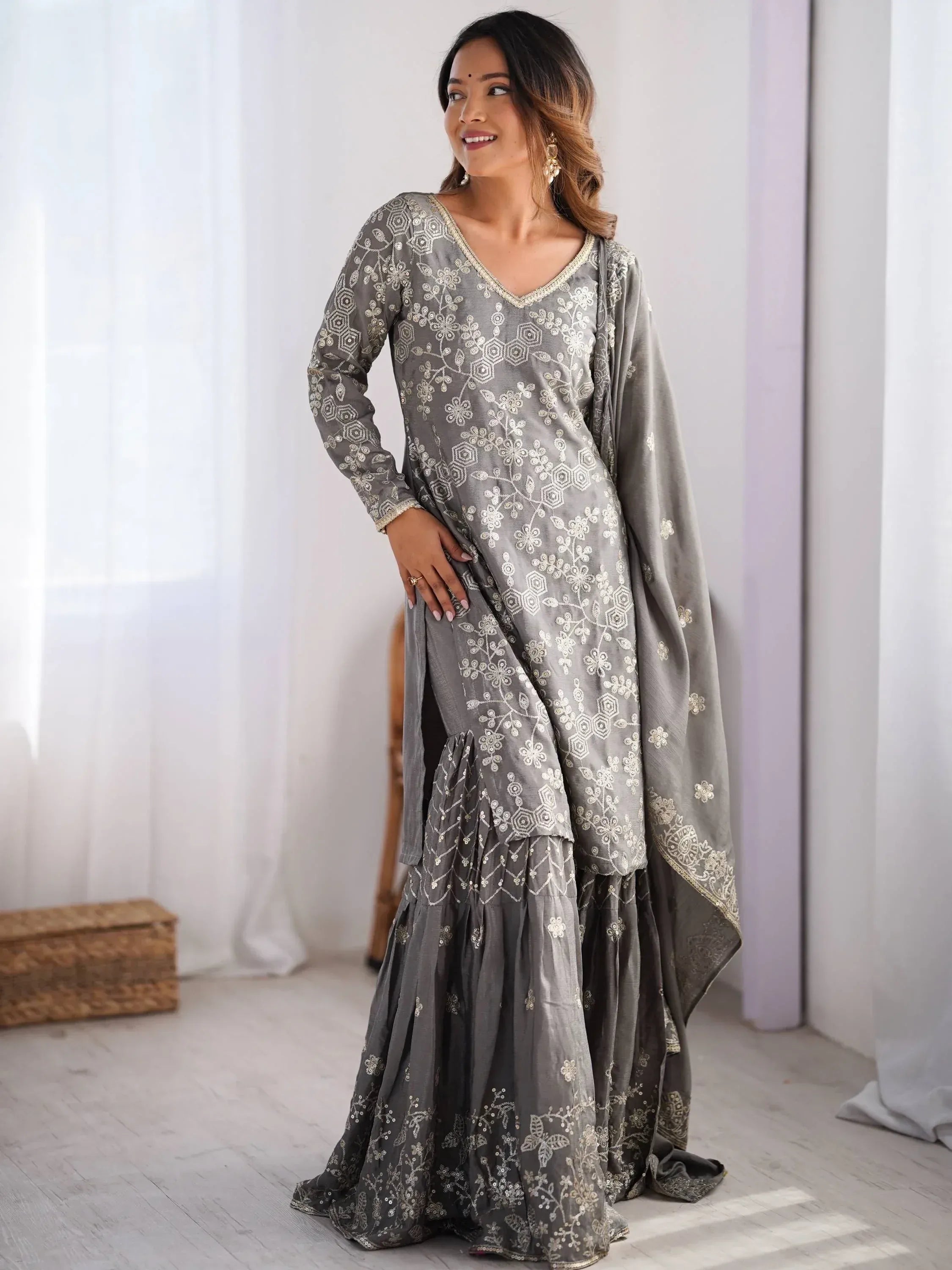 Grey embroidered salwar kameez with floral gold detailing, perfect for ethnic occasions