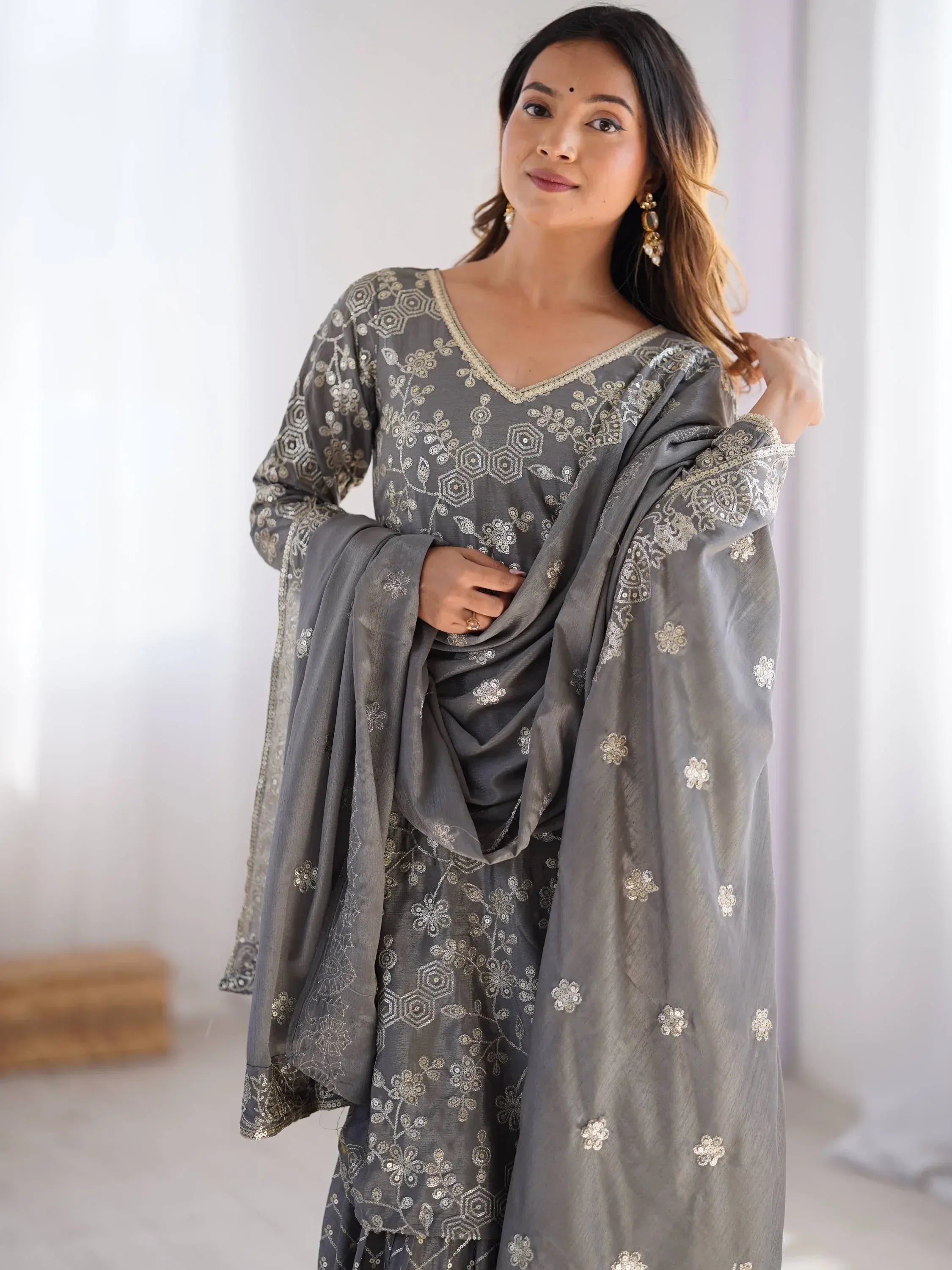 Grey embroidered salwar kameez with floral sequin work, perfect for Indian ethnic wear occasions.