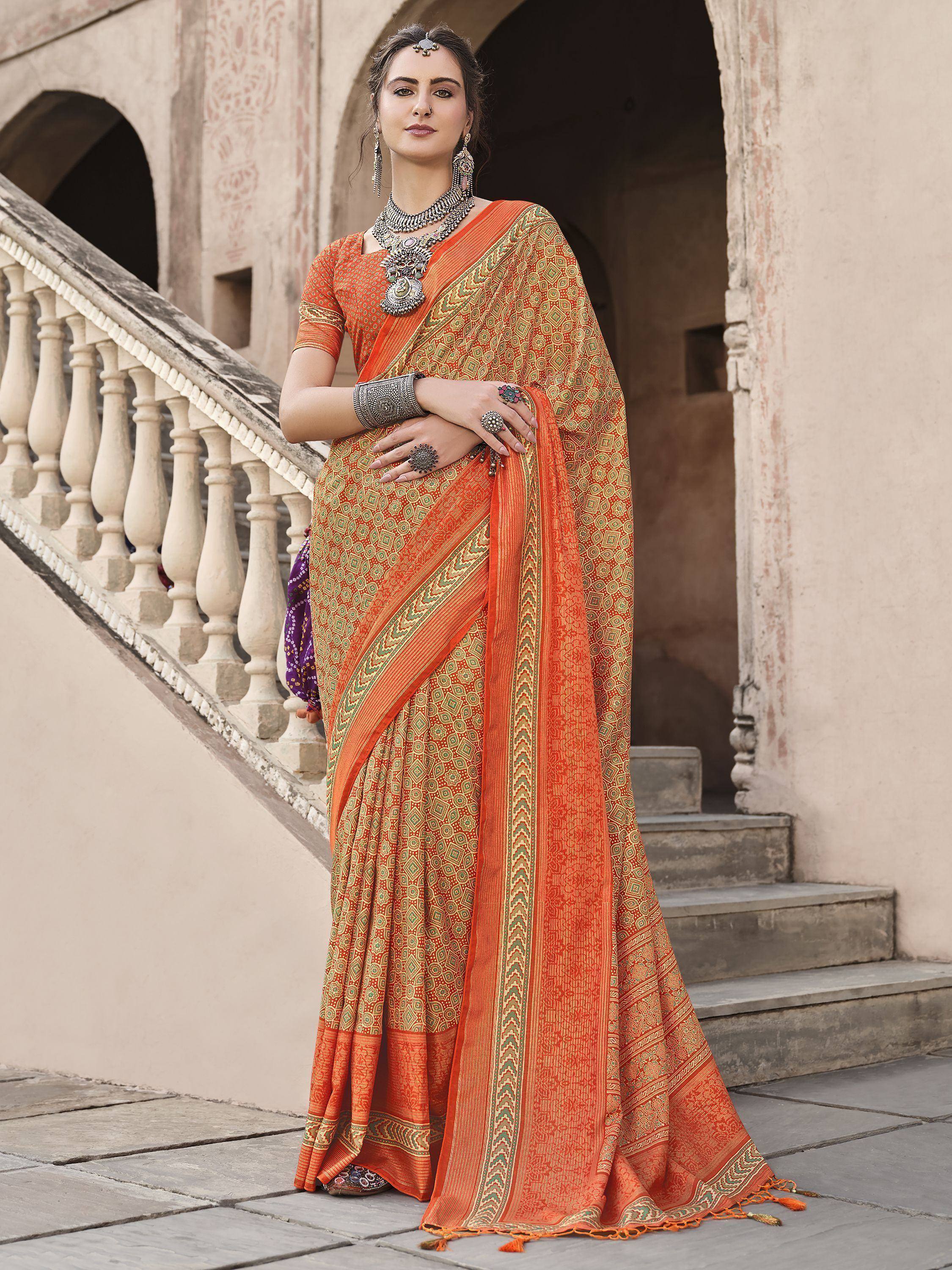 Orange printed saree with green border, traditional Indian ethnic wear for women