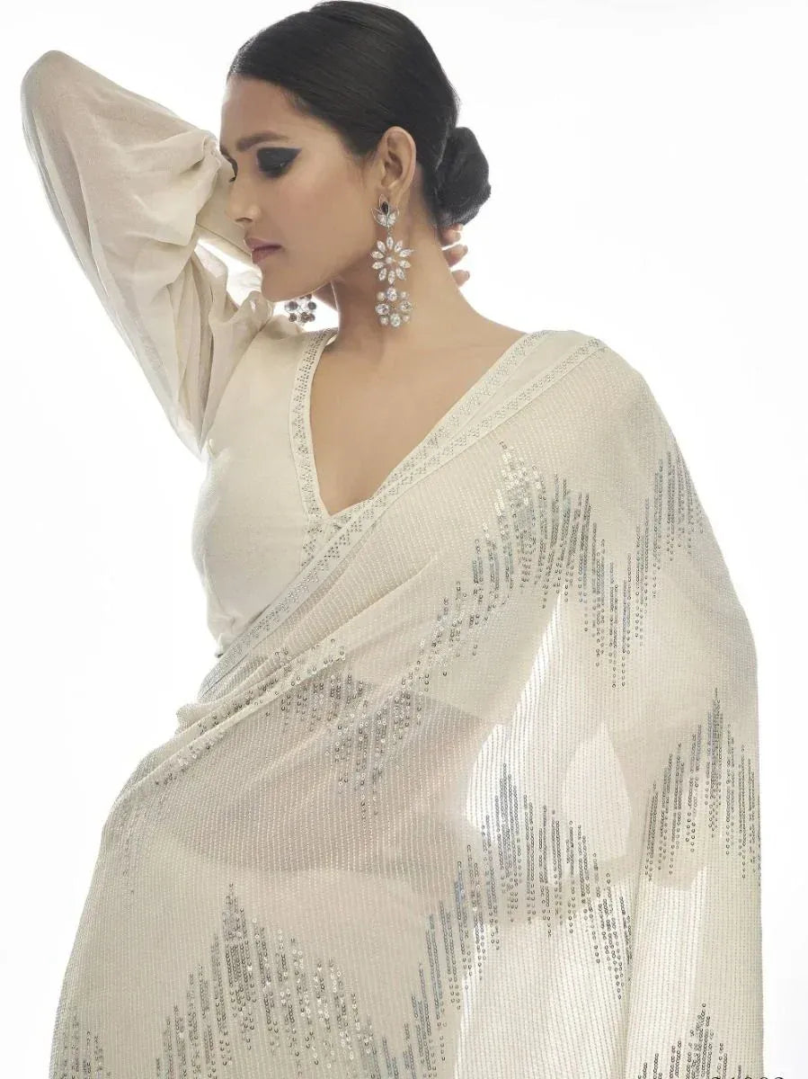 Elegant ivory saree with silver sequin detailing, perfect for Indian ethnic wear occasions