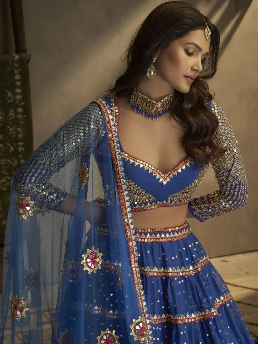 Blue designer lehenga choli with gold embroidery and sequins, perfect for Indian ethnic wear