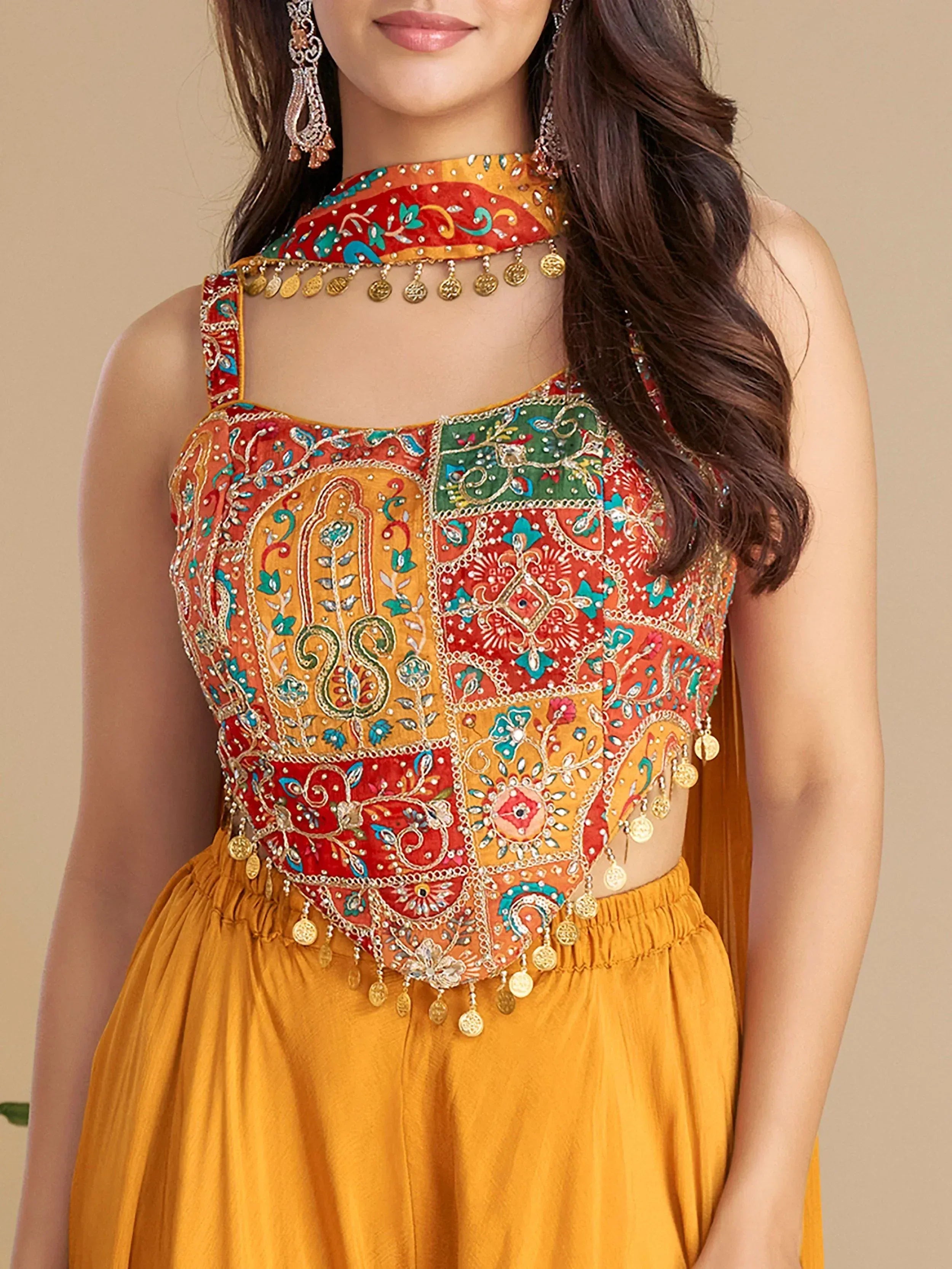 Colorful embroidered Indian ethnic top with mirror work and coin detailing, paired with mustard skirt