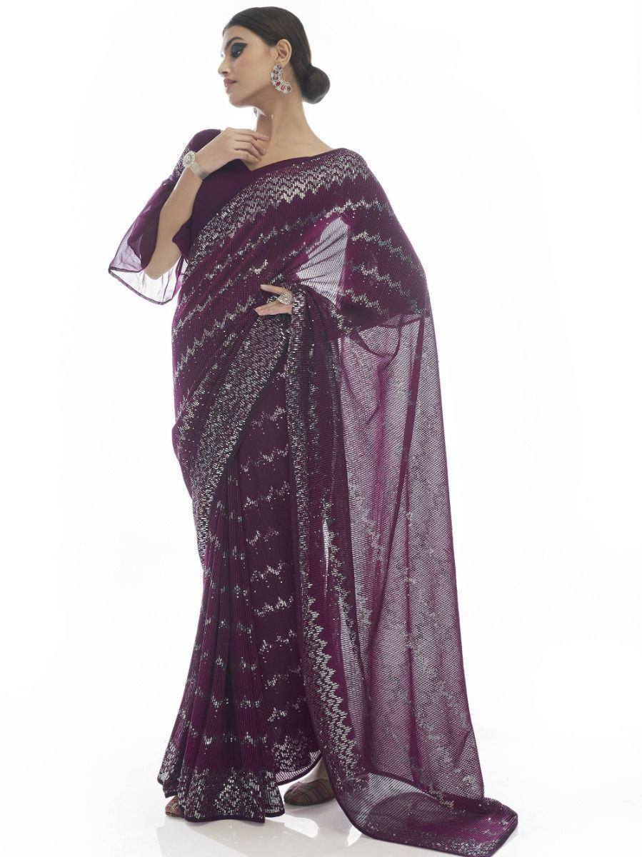 Elegant purple designer saree with silver embroidery and sheer pallu, perfect for Indian ethnic wear occasions.